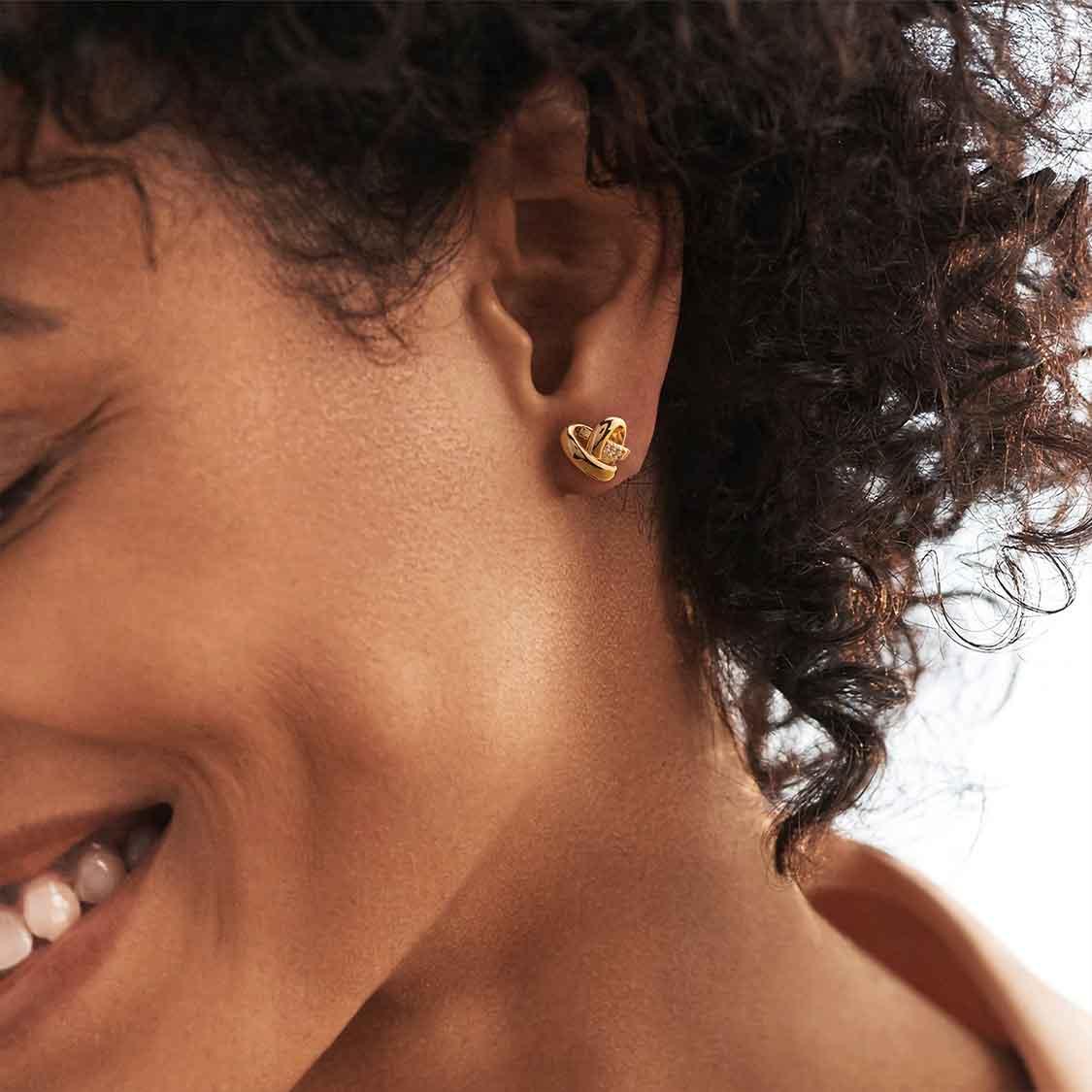 MYEARS Knot Heart Stud Earrings worn by woman, gold heart stud earrings suitable for everyday wear and as a gift