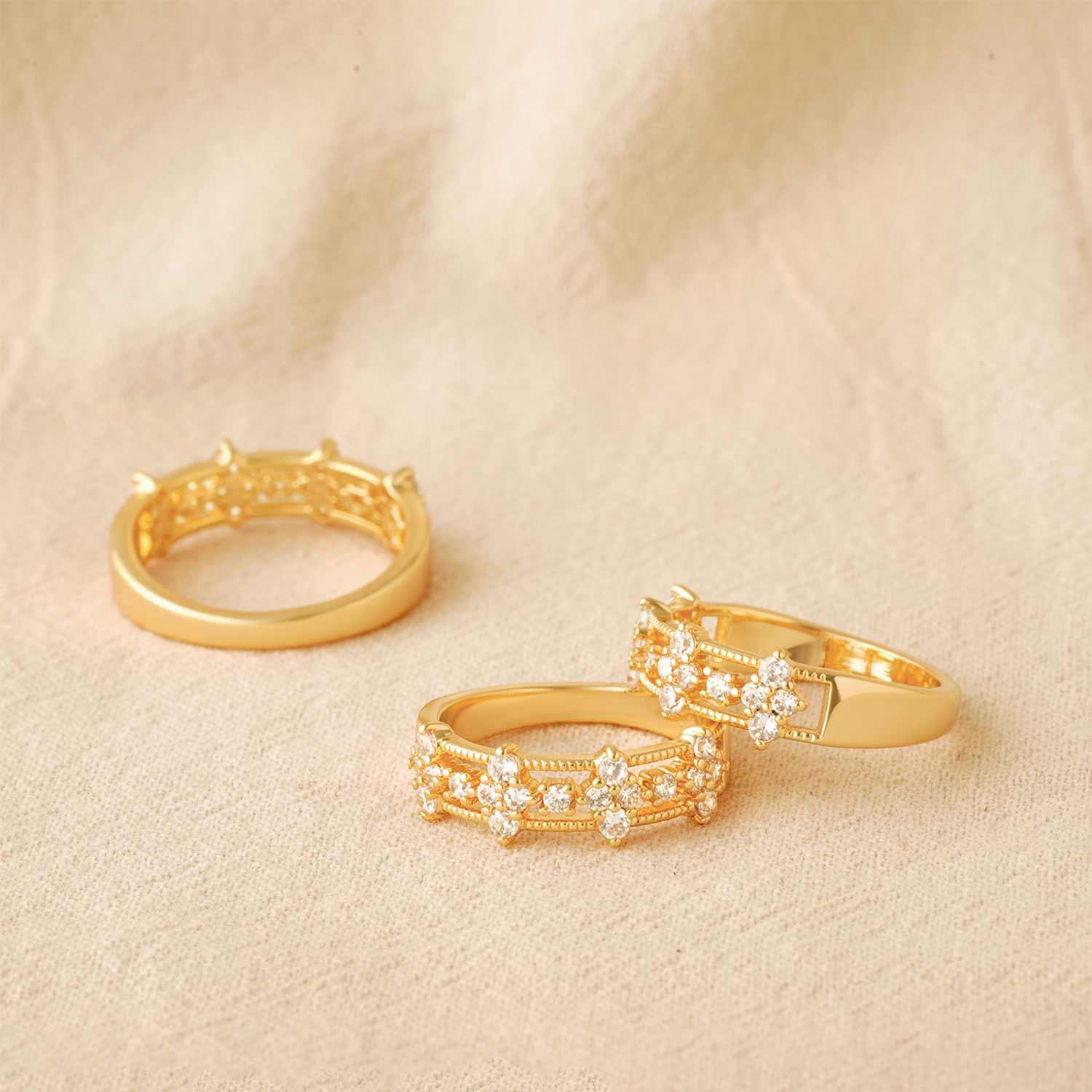 Close-up detail of MYEARS gold cz flower band ring design