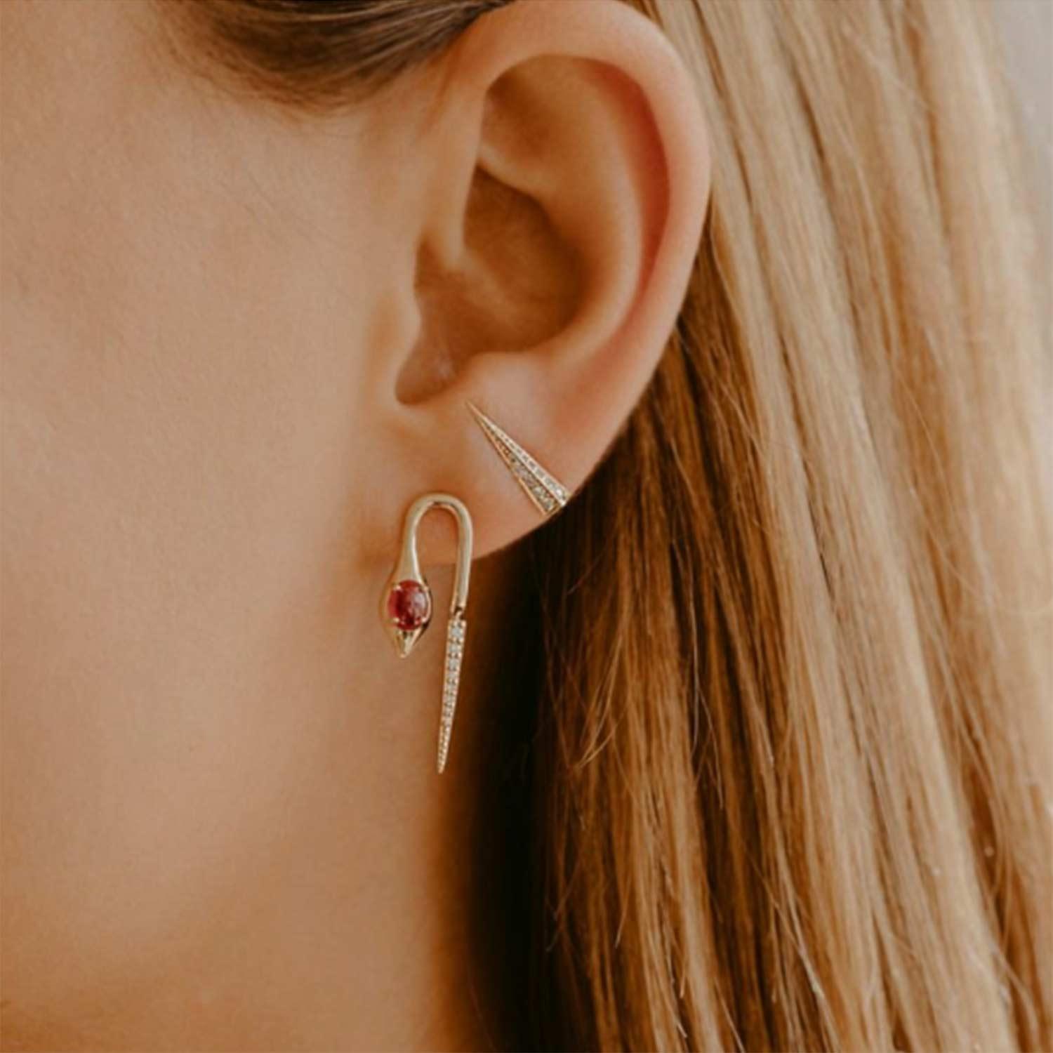 Close-up of model wearing MYEARS Pyramid Drop stud earrings in gold, elegant earrings for women