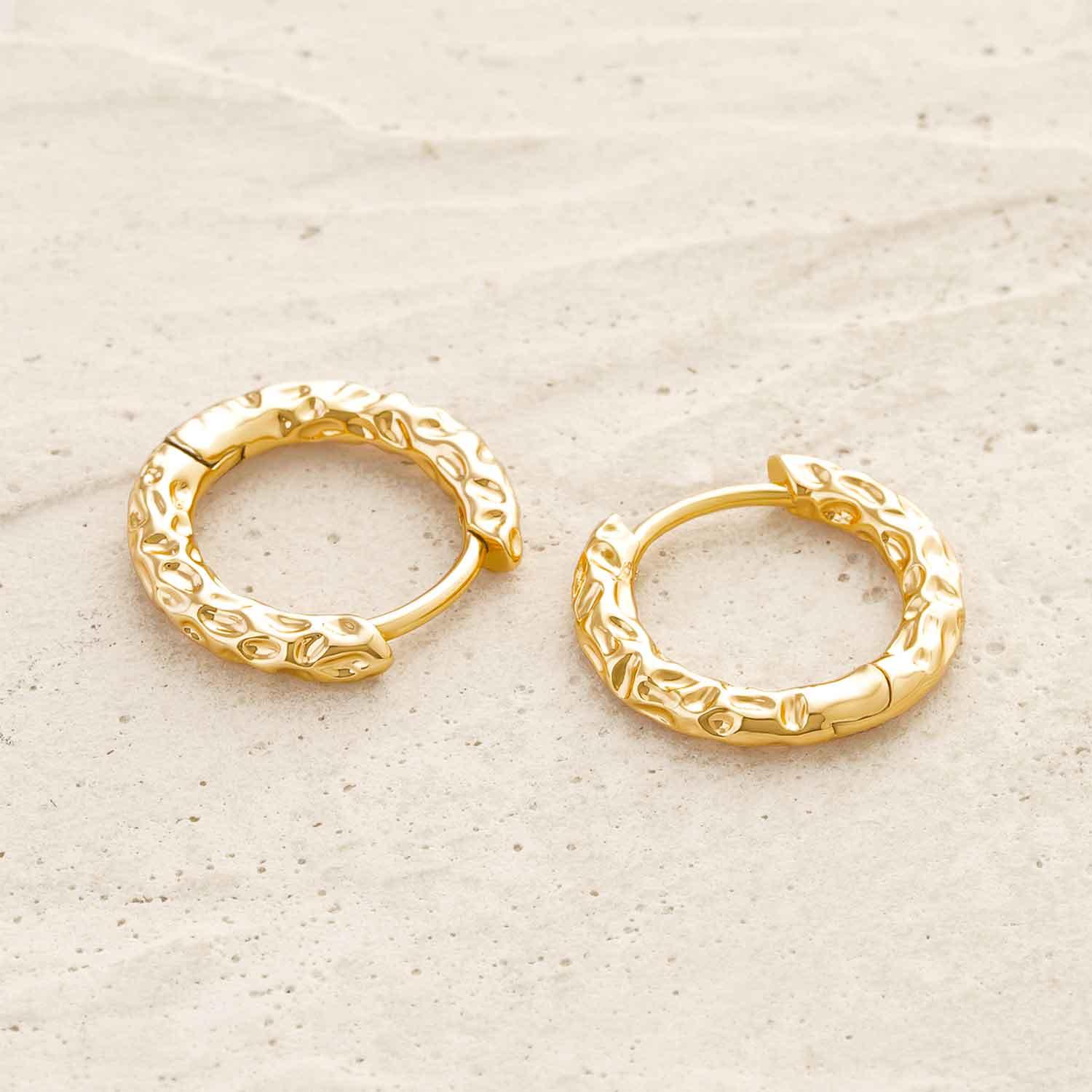 Detailed view of MYEARS® gold hammered hoop earrings showcasing the textured surface and refined craftsmanship