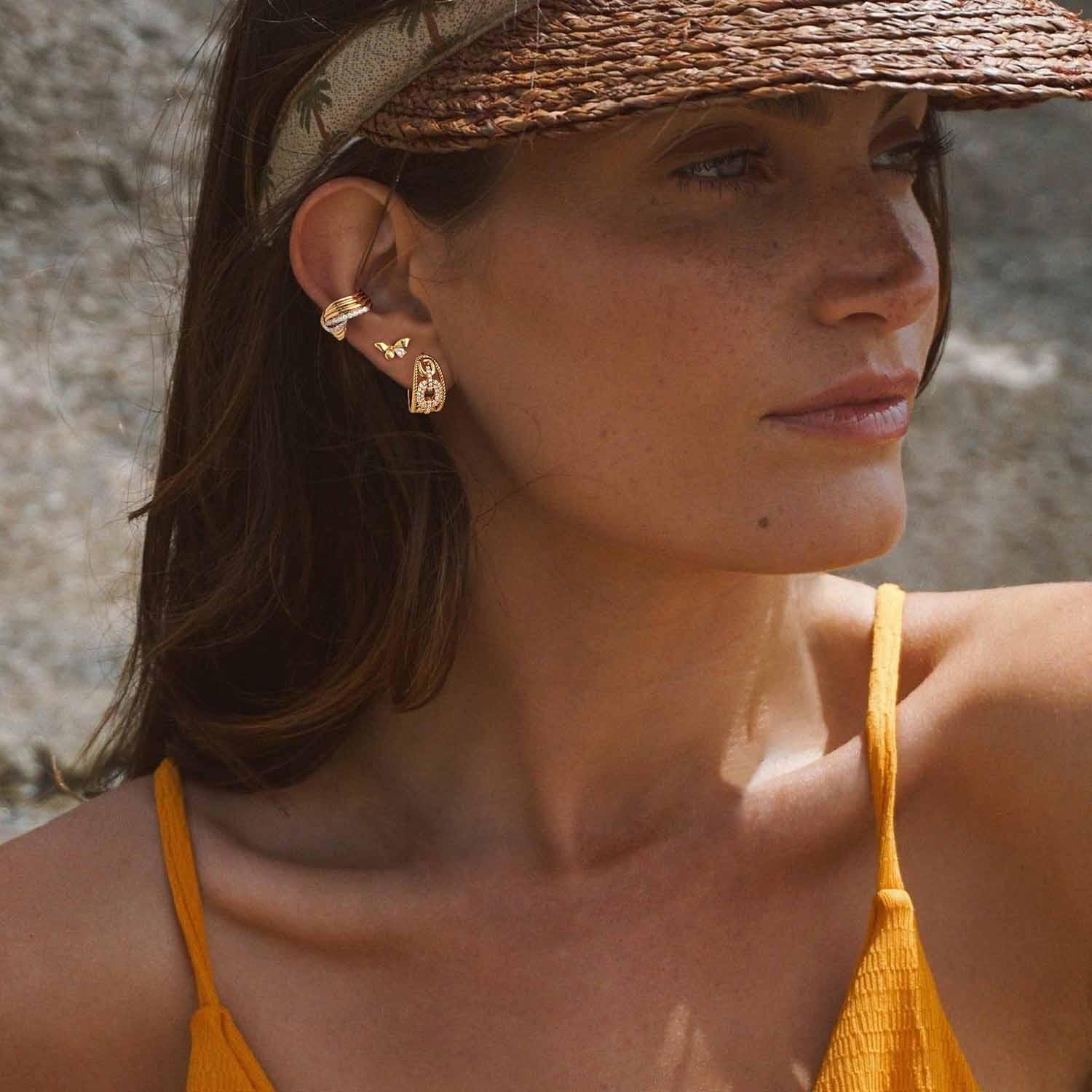 Model wearing MYEARS® gold bow stud earrings, stylish accessory for women, perfect for everyday wear and gifting.