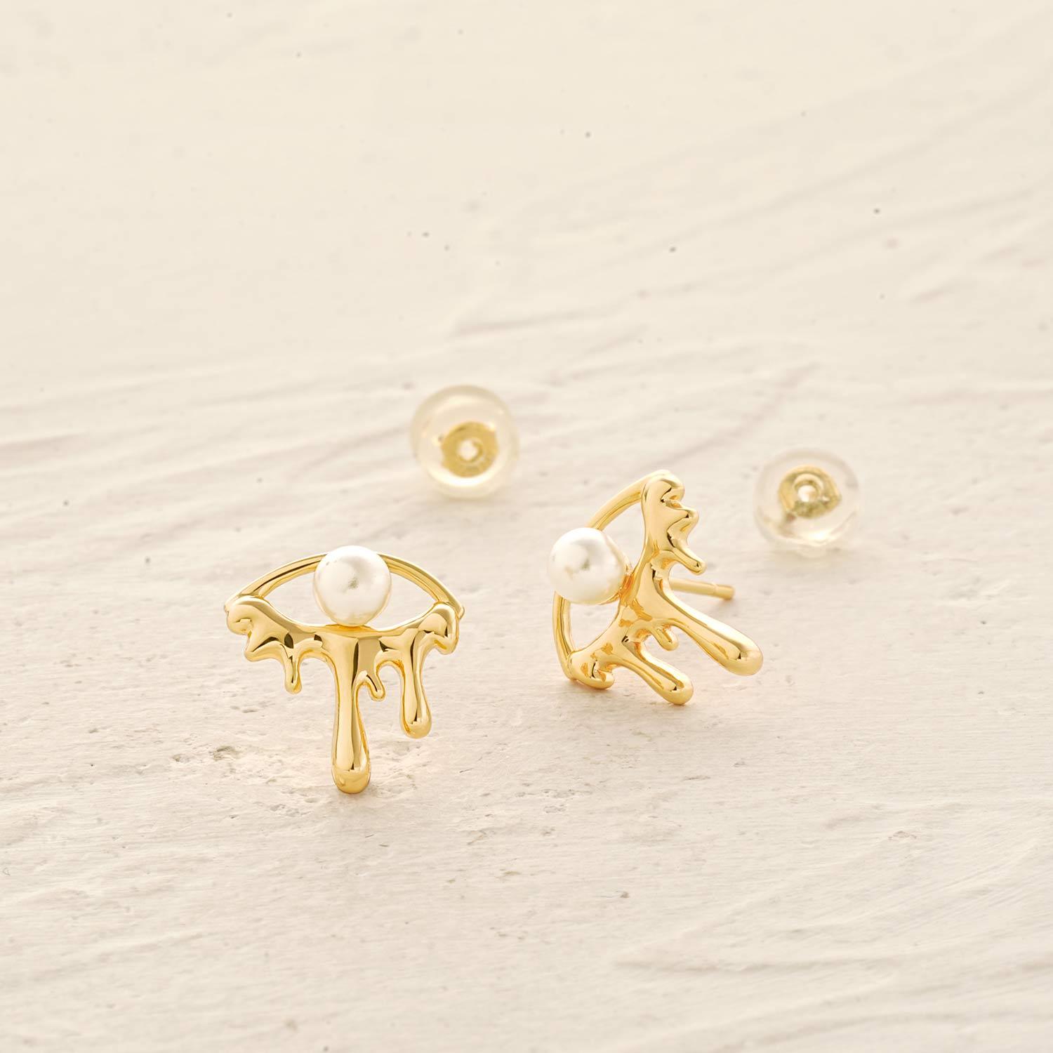 Detailed view of MYEARS® dripping pearl evil eye stud earrings showing the dripping pearl design and evil eye craftsmanship.