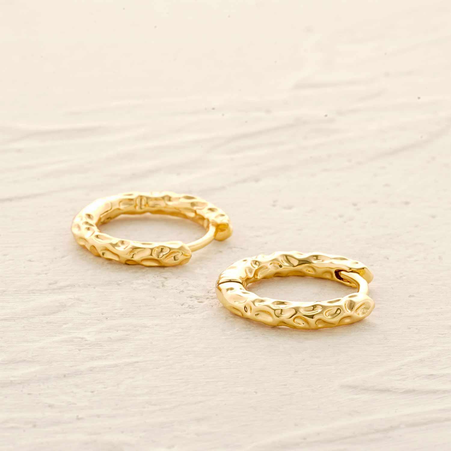 Lifestyle image of MYEARS® gold hammered hoop earrings styled for women’s everyday wear