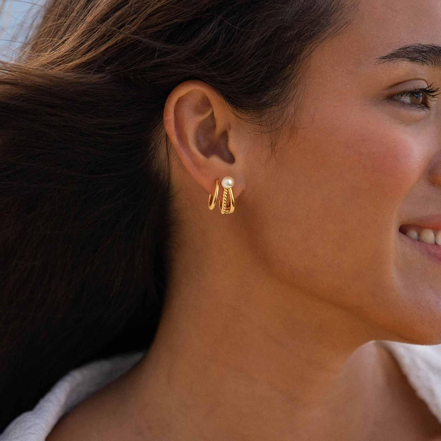 Model wearing MYEARS® twisted split pearl hoop earrings, elegant everyday pearl hoops with twisted split design for women.