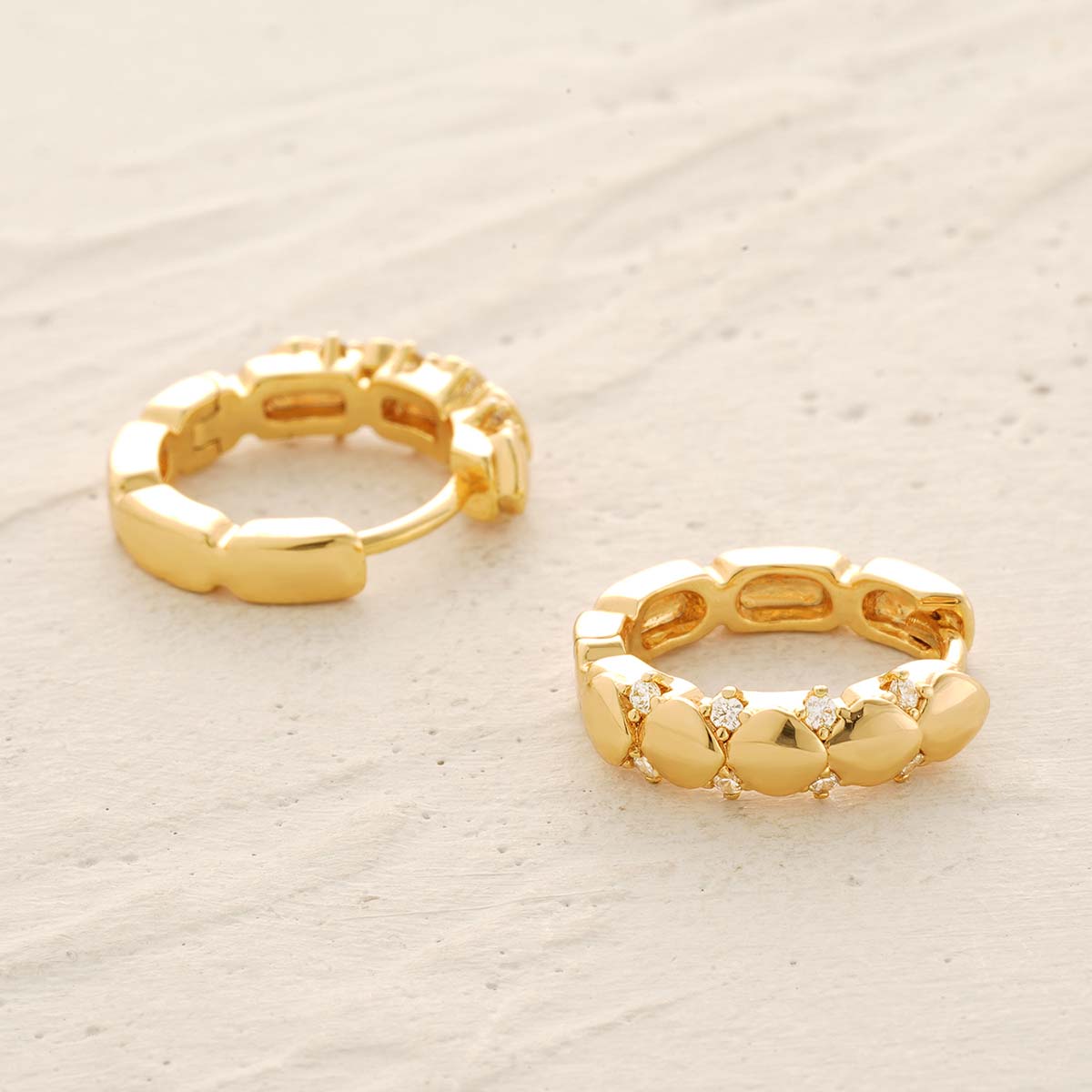 Detailed view of MYEARS® Beaded CZ Huggie Hoop Earrings in gold, highlighting sparkling cubic zirconia beads, textured finish, and elegant design