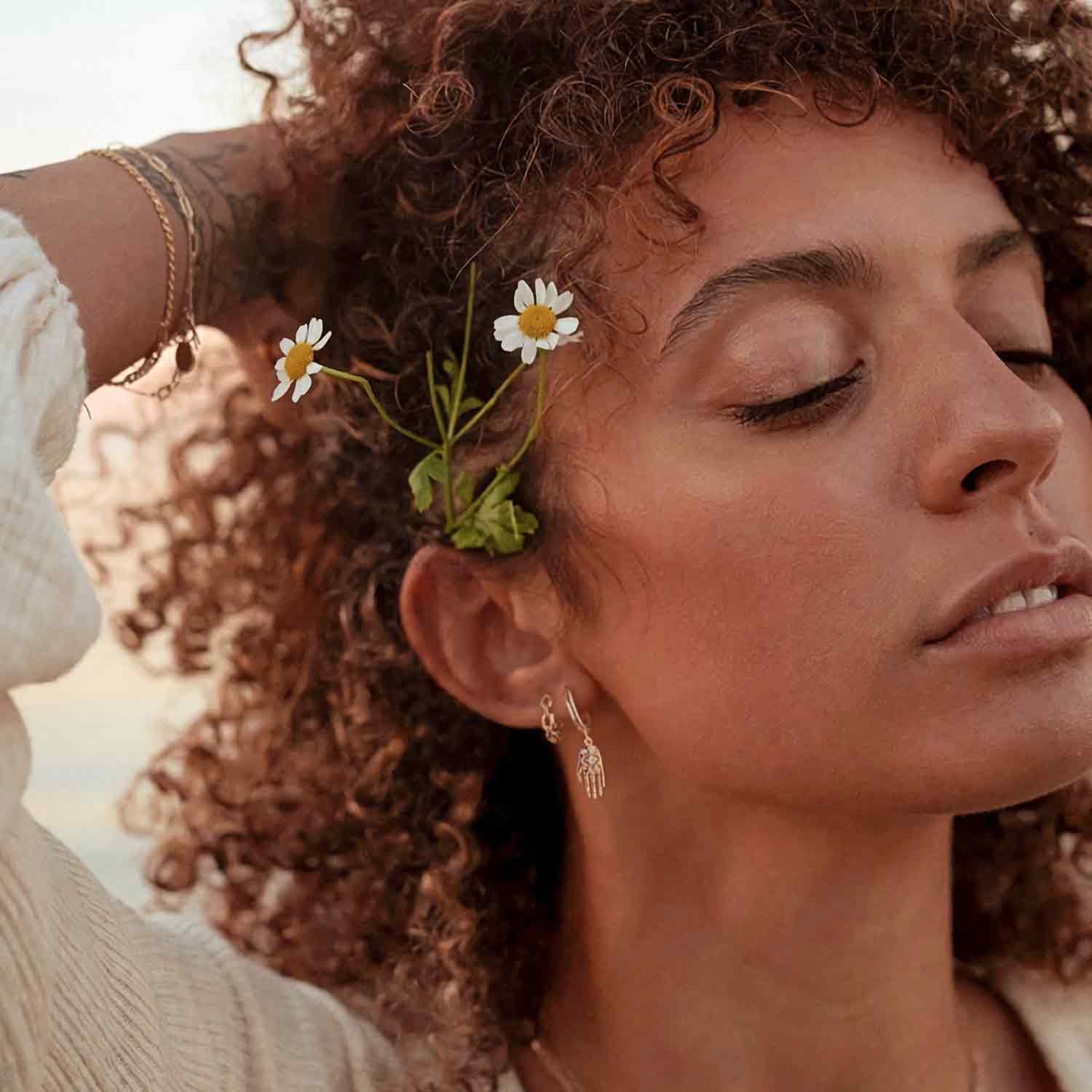 Close-up of a model wearing MYEARS® Link Chain Huggie Hoop Earrings, 14K gold, showing chain link detail, chic and modern earrings for women, perfect gift and everyday wear accessory.
