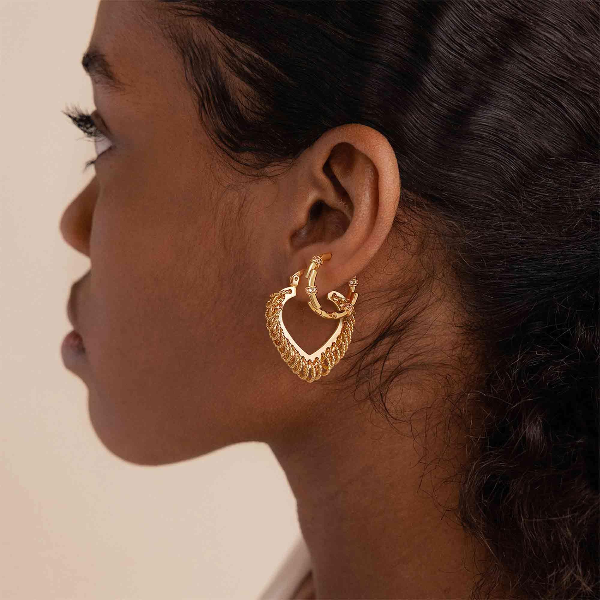 Close-up of a model wearing MYEARS® Rhombic Tassel Hoop Earrings, highlighting geometric rhombus shape with delicate tassel.