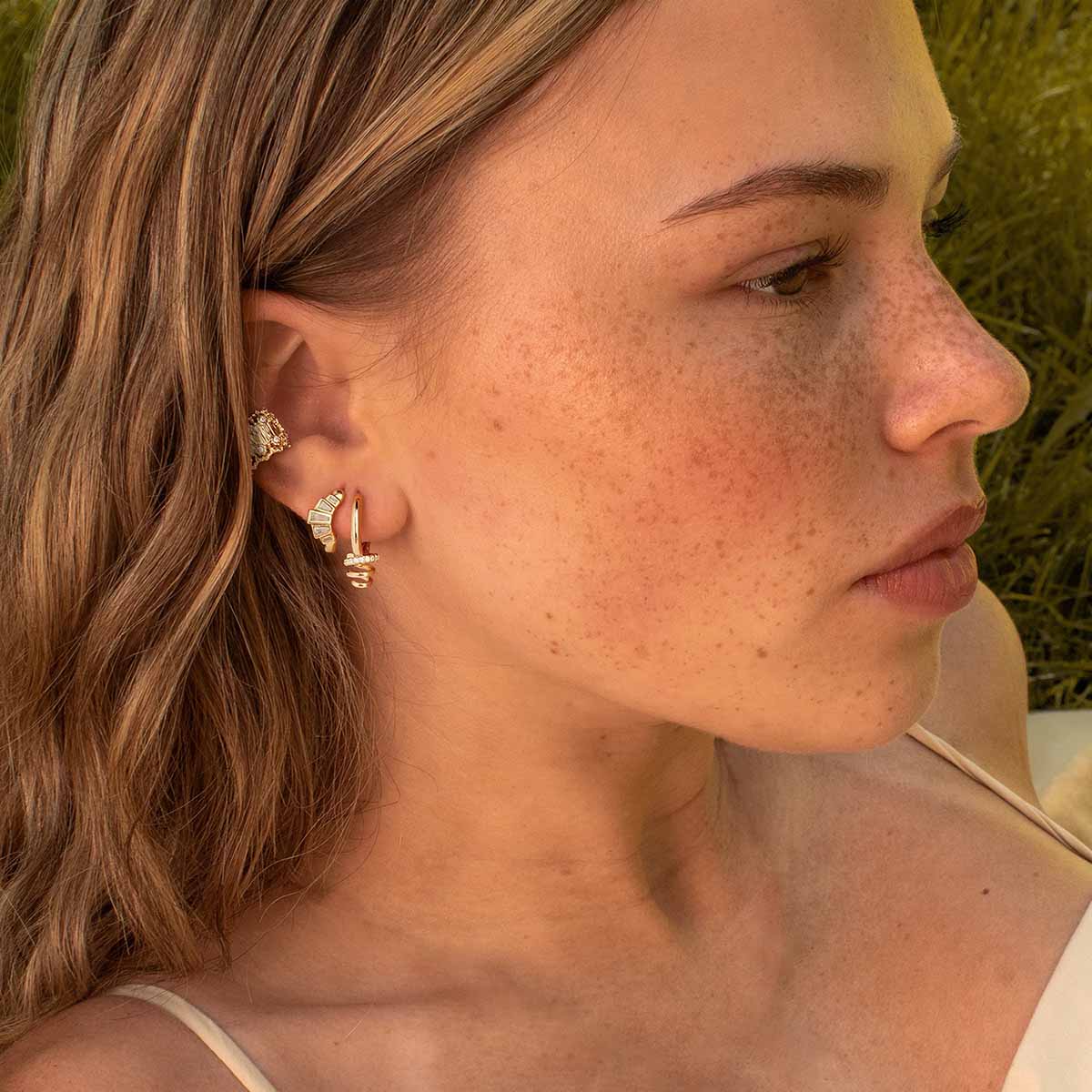 Close-up of MYEARS® Gold Spiral Drop CZ Hoop Earrings, highlighting sparkling cubic zirconia and unique spiral design