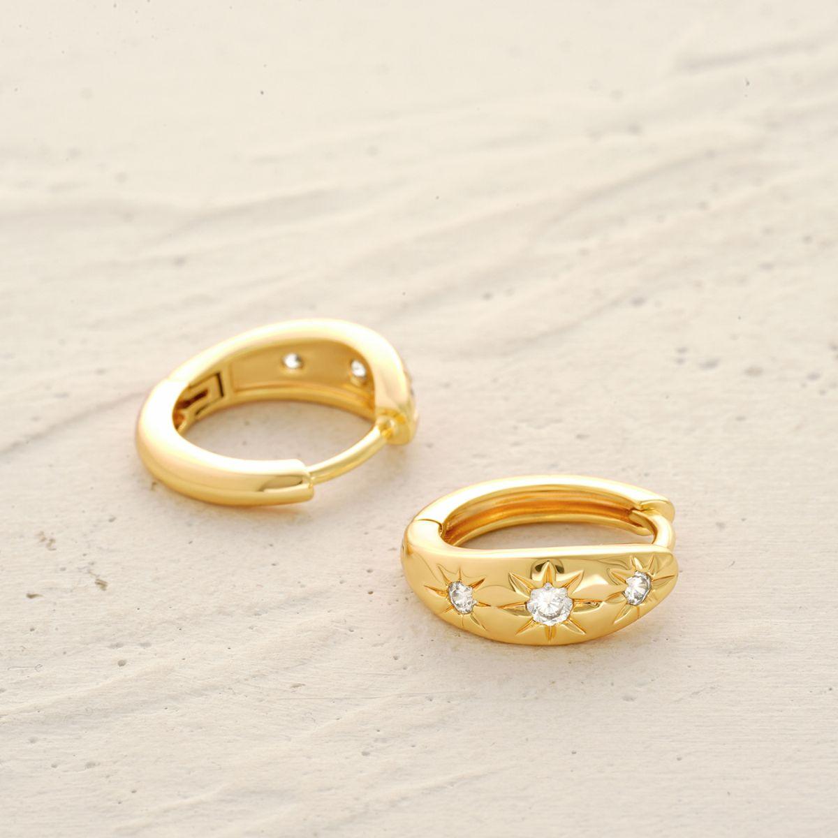 Detail of MYEARS® Gold Triple Stars Huggie Earrings showing triple star accents and polished finish