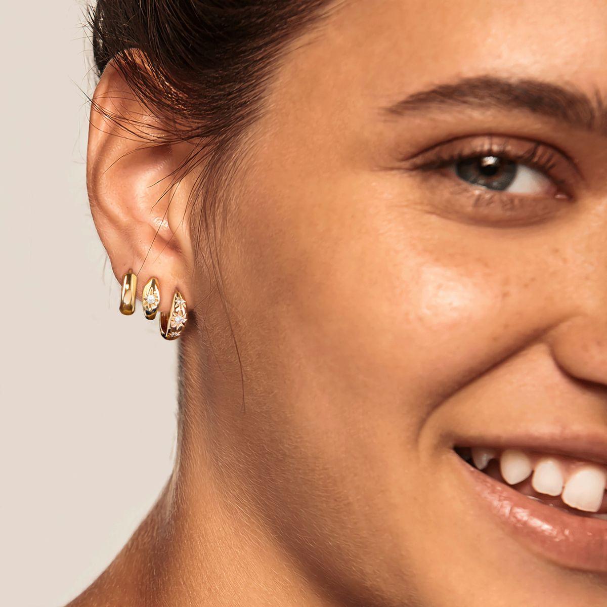 MYEARS® Gold Triple Stars Huggie Earrings worn by model, star huggie earrings for women, everyday wear
