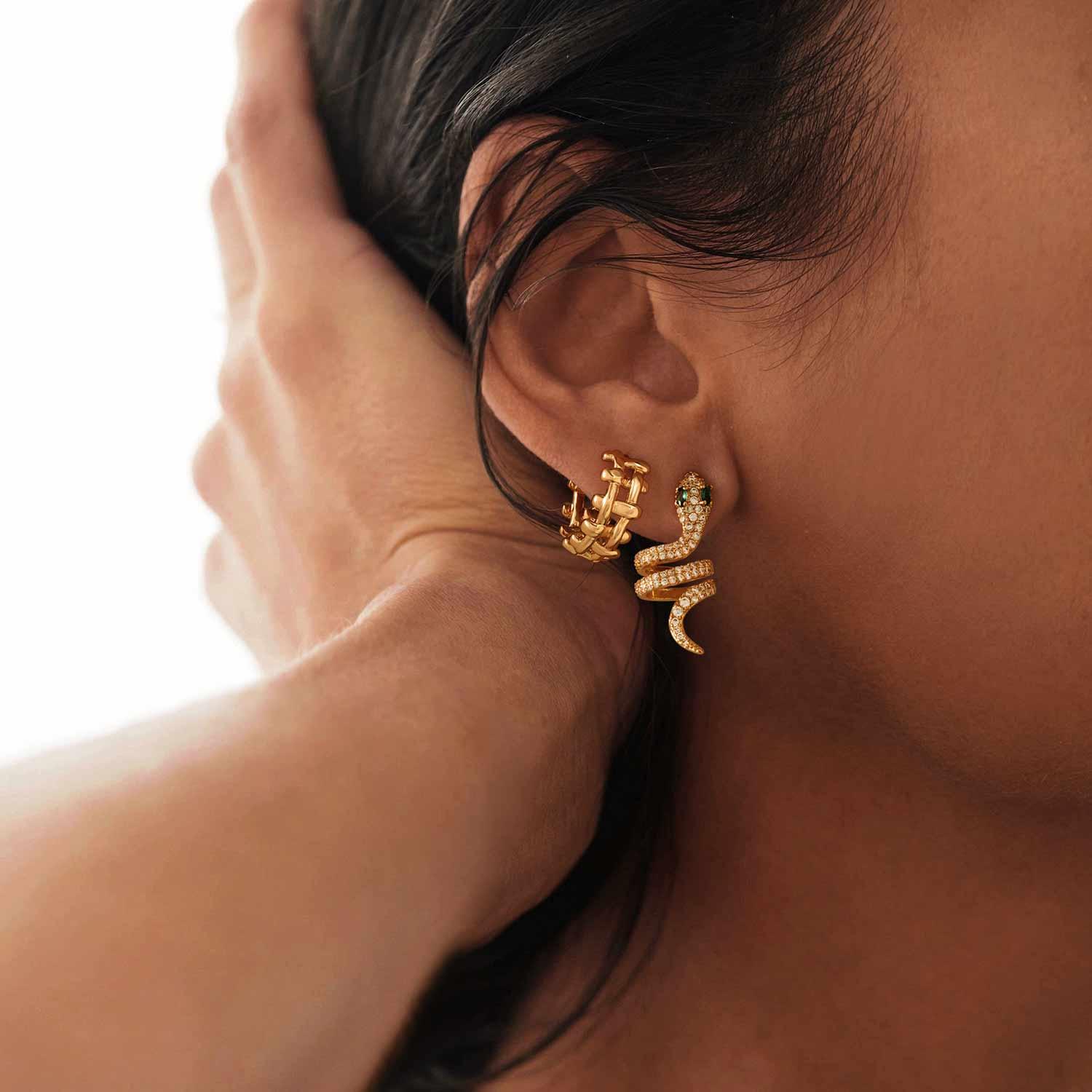 Close-up of a model wearing MYEARS® Braided Hoop Earrings, 14K gold plated, showcasing intricate braided design, chic earrings for women, ideal gift and elegant everyday accessory.