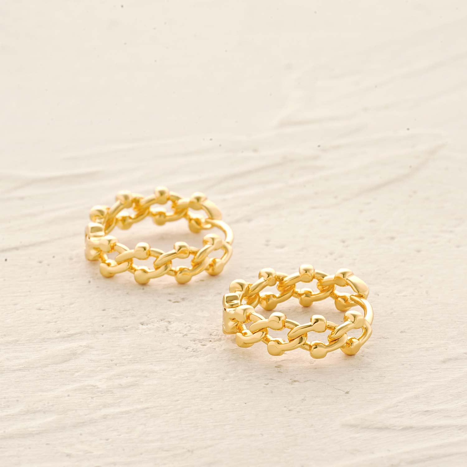 Detailed view of MYEARS® chain link huggie hoop earrings showing the intricate gold links and polished craftsmanship