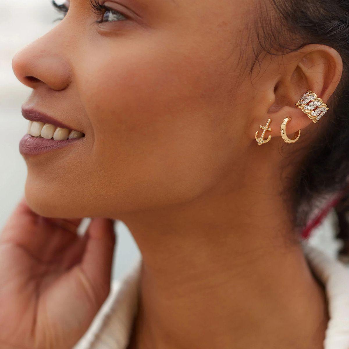 Close-up of a model wearing MYEARS® Chain Pave Wide Ear Cuffs in gold, showcasing its intricate pave design and wide ear cuff style for a chic and elegant look