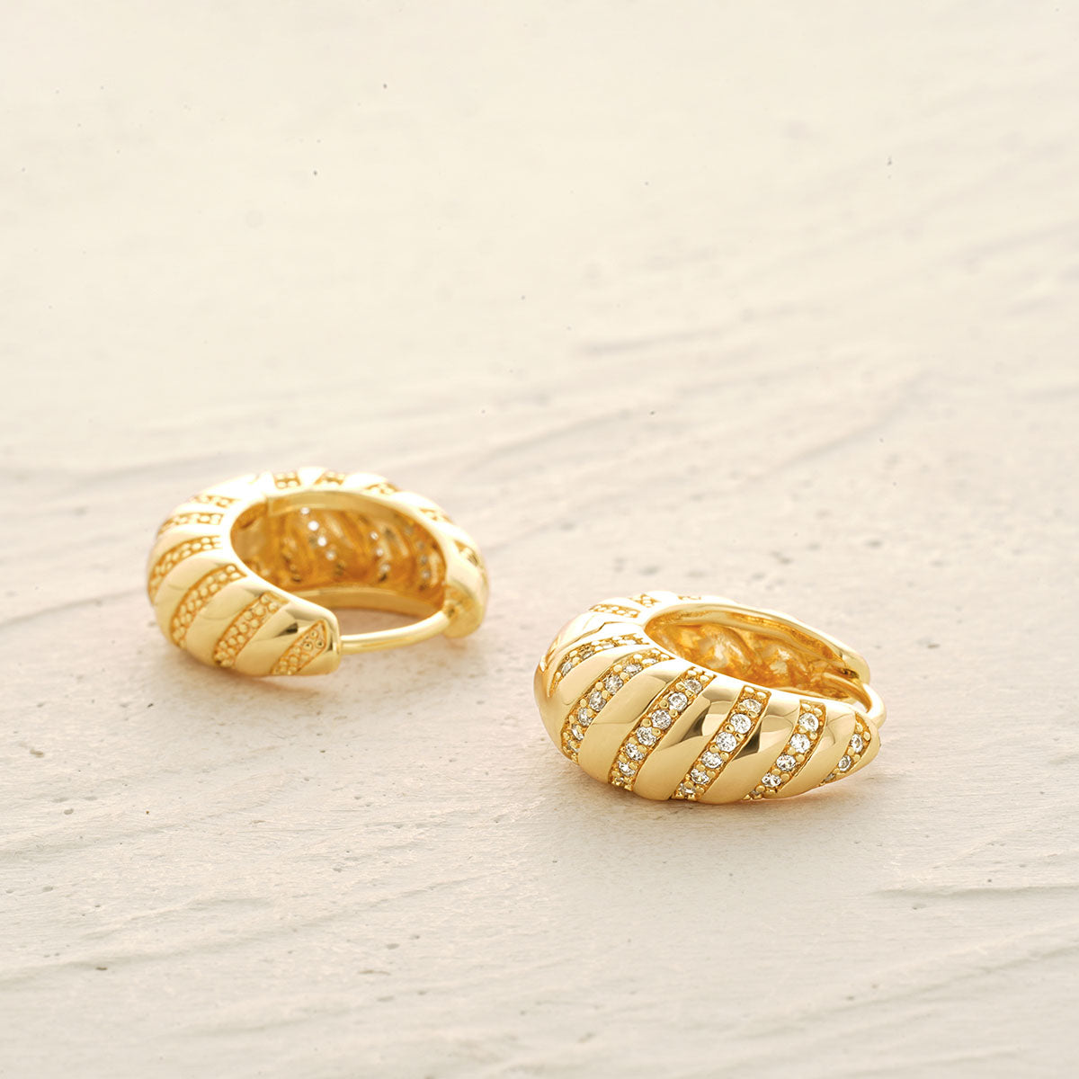 Detailed view of MYEARS® Chunky Croissant CZ Hoop Earrings in gold, showing textured chunky hoop, sparkling cubic zirconia stones