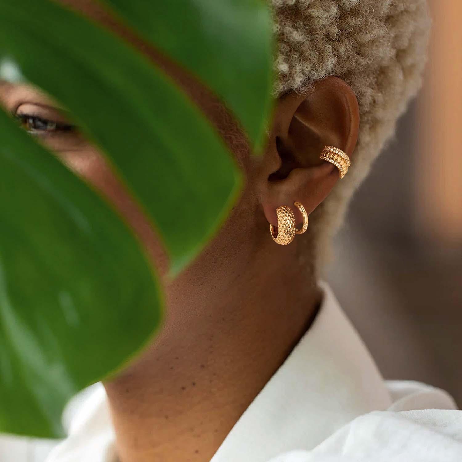 MYEARS® chunky snakeskin huggie hoop earrings close-up, gold hoops with textured design for women