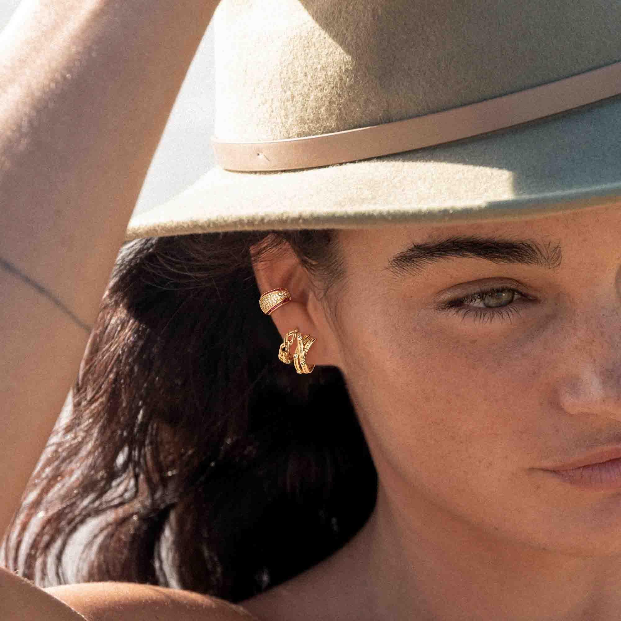 Lifestyle view of MYEARS® Crossover CZ Dot Hoop Earrings in gold, ideal as a gift or to enhance everyday outfits with subtle sparkle