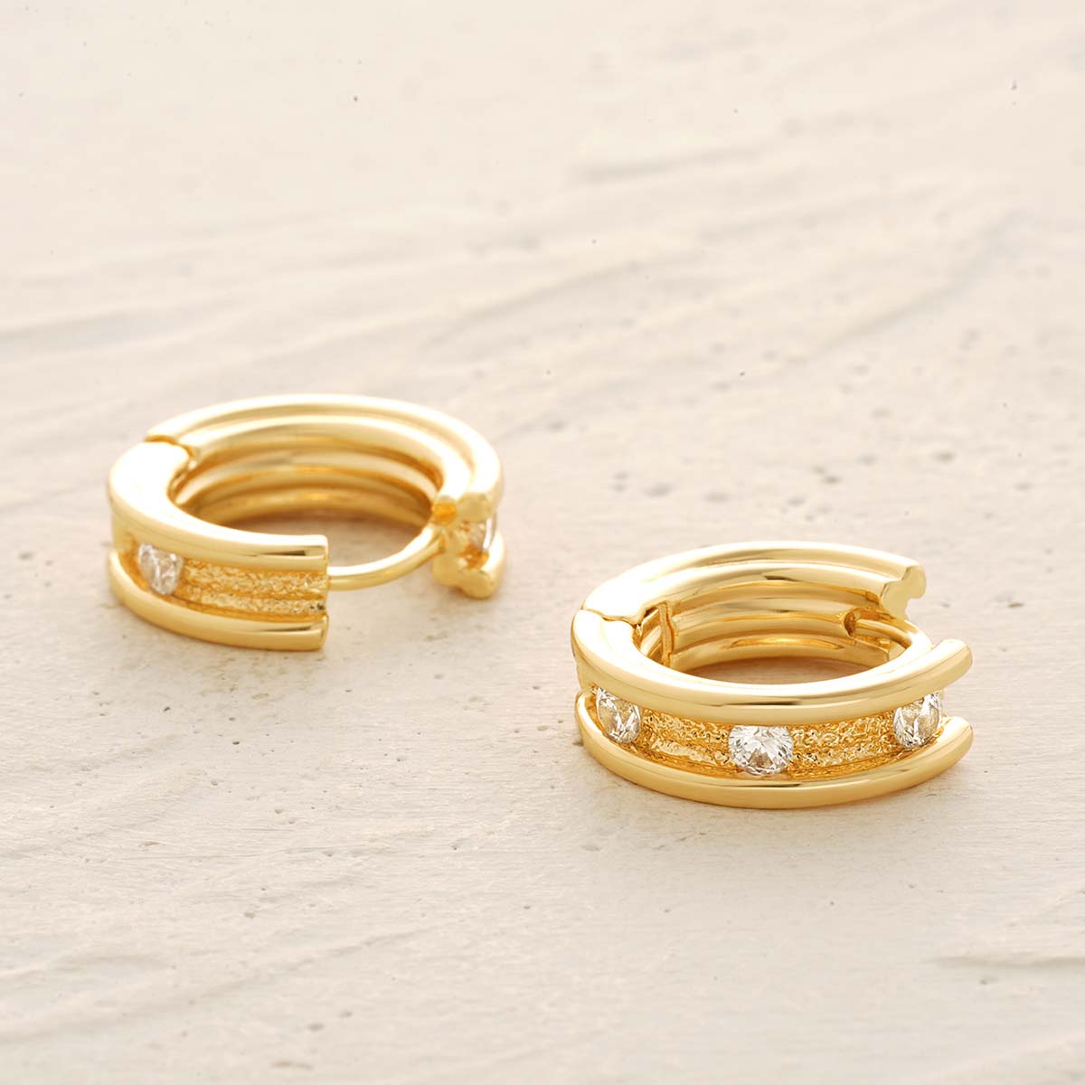 Detailed view of MYEARS® CZ Channel Hoop Earrings in gold, focusing on the channel-set cubic zirconia