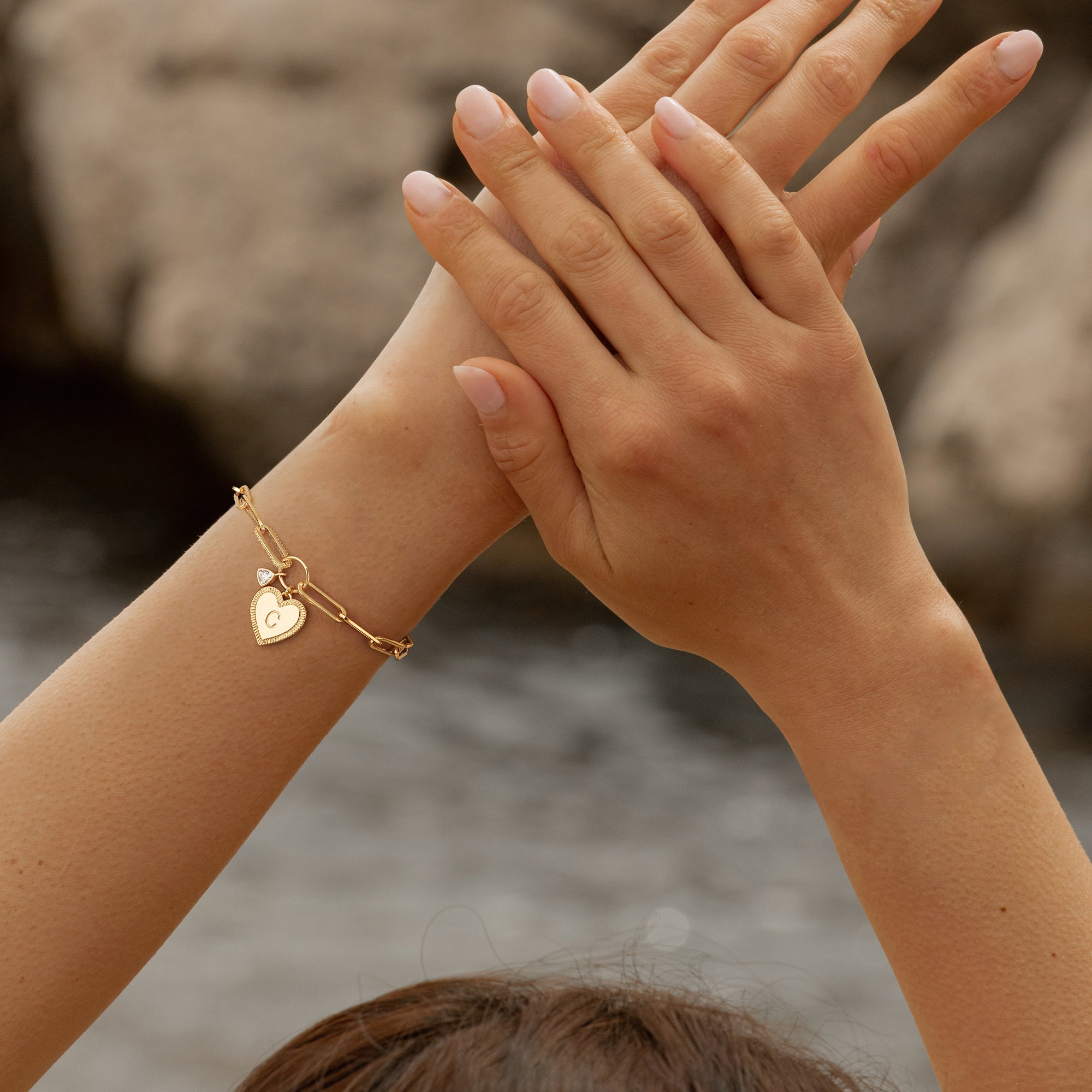 Model wearing MYEARS Gold Initial Heart Chain Bracelet, stylish gold bracelet with heart initial pendant for women