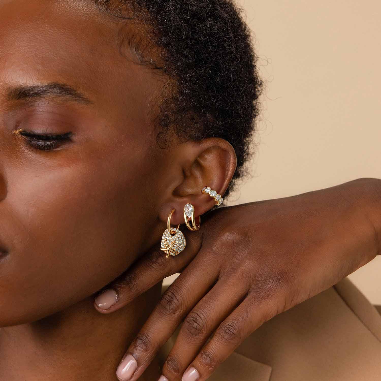 Close-up of MYEARS® Starfish Dangle Hoop Earrings in gold, stylish earrings for women