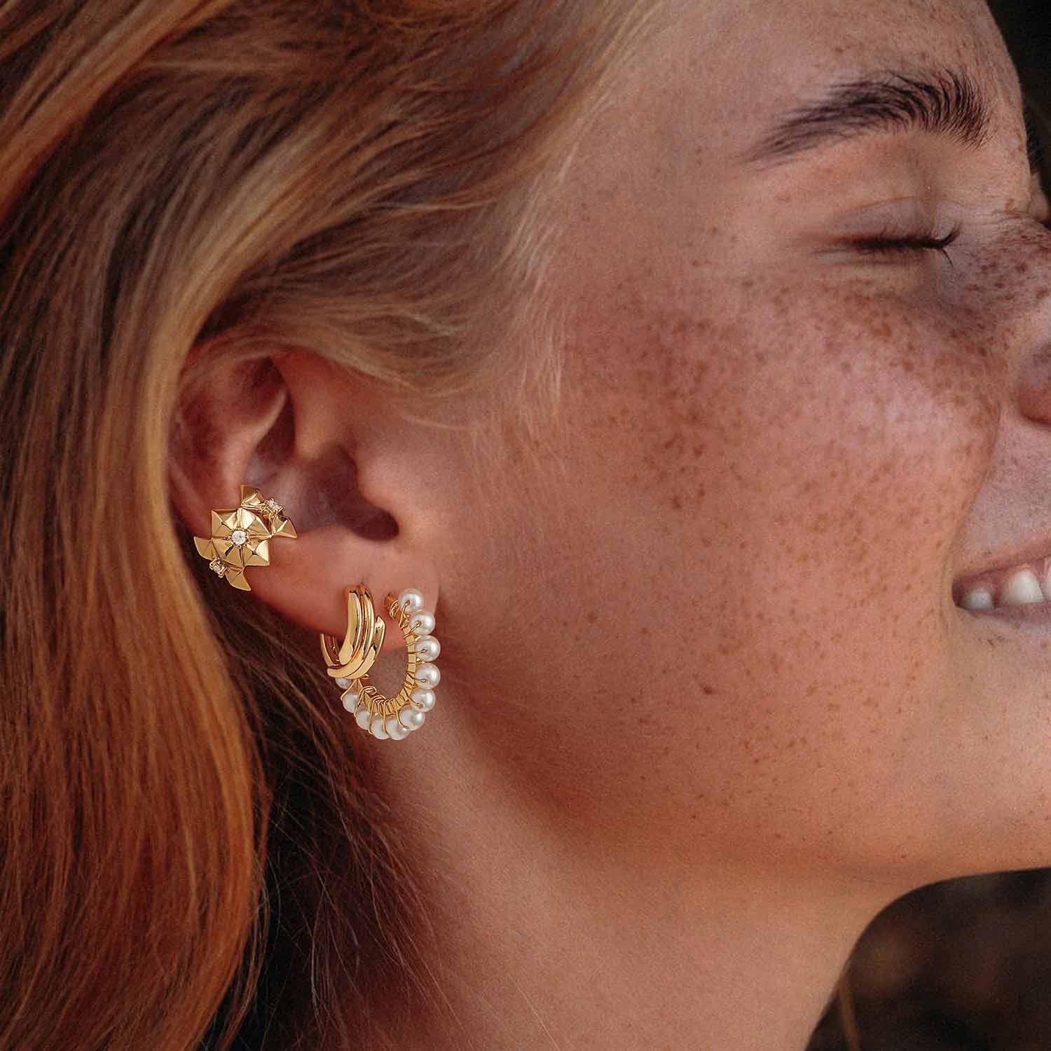 Close-up of MYEARS® Gold Sun Pearl Beaded Huggie Earrings worn by model, delicate gold hoops for women