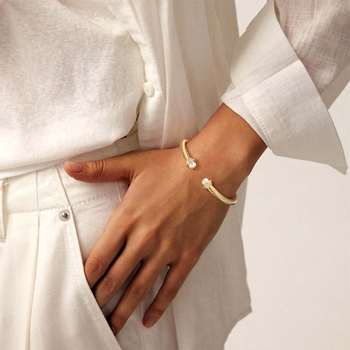 Model wearing the Myears® gold twisted open cuff bracelet in a natural daily look, adjustable open cuff bracelet for women.