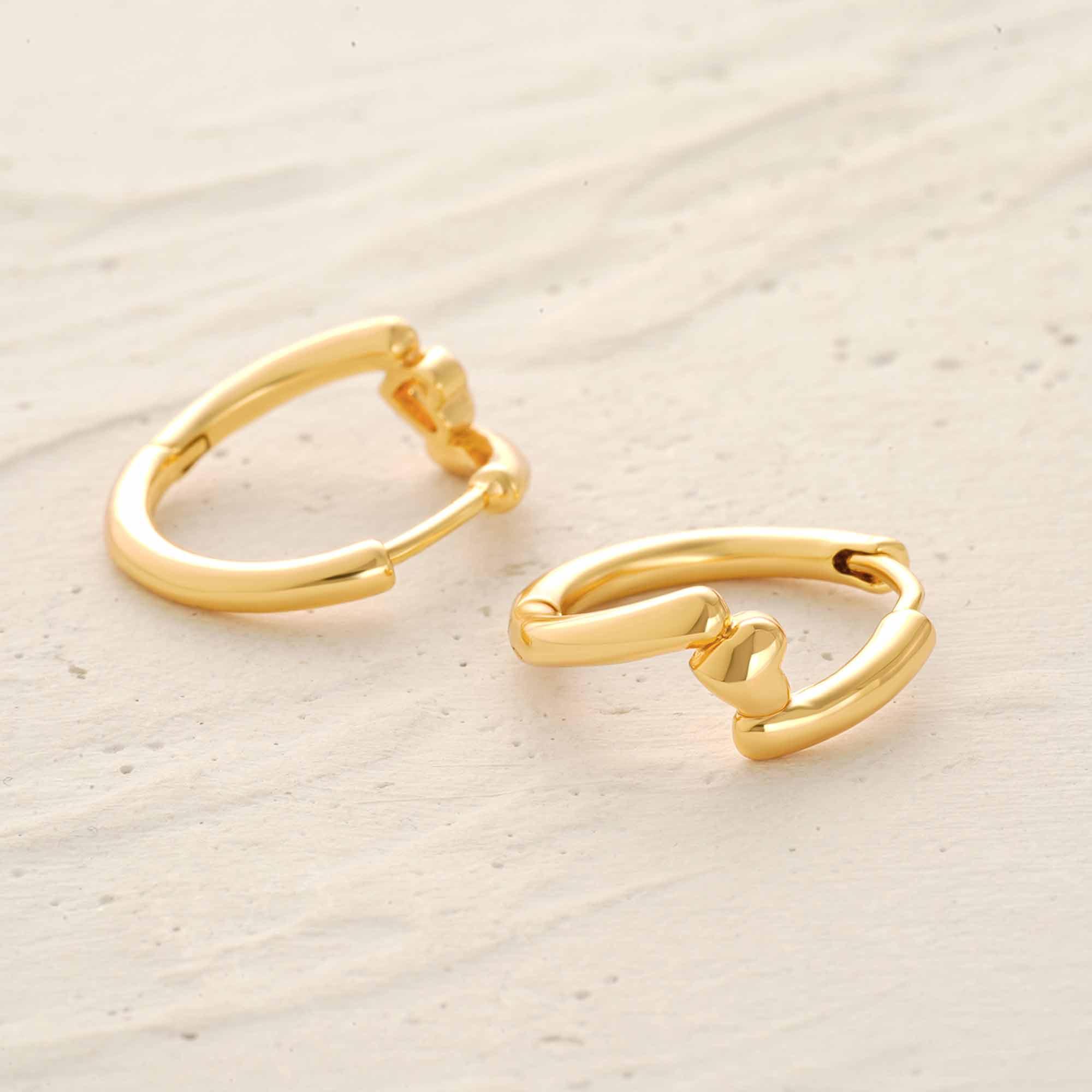 Close-up detail of MYEARS Heart Hinged Huggie Hoop Earrings showing heart design and hinged closure