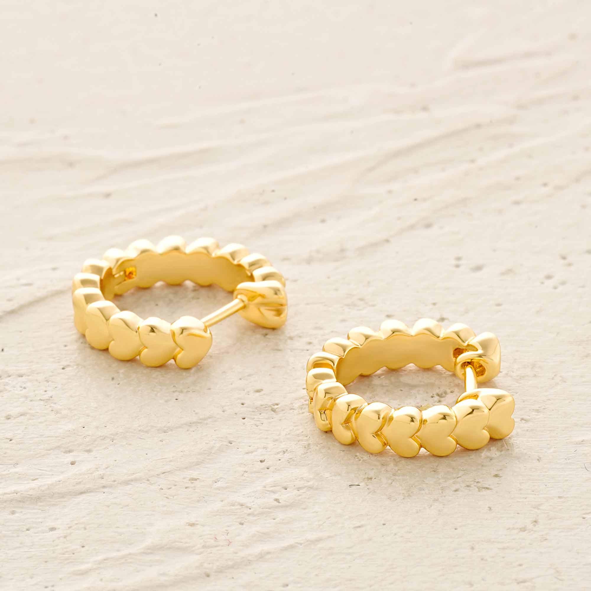 Detailed view of MYEARS® Heart Stack Huggie Hoop Earrings in gold, highlighting craftsmanship and elegant heart stacking