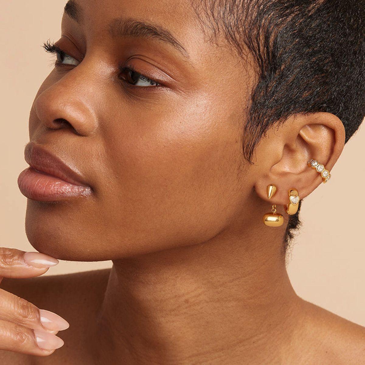 Close-up of model wearing MYEARS® hexagonal crystal ear cuffs, showcasing elegant gold design for women
