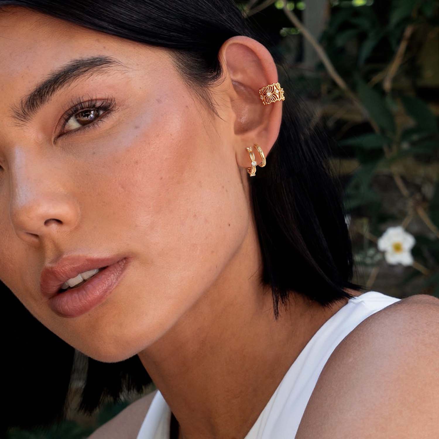 Close-up of MYEARS® Knot CZ Hoop Earrings on model, showing sparkling cubic zirconia details and elegant gold finish
