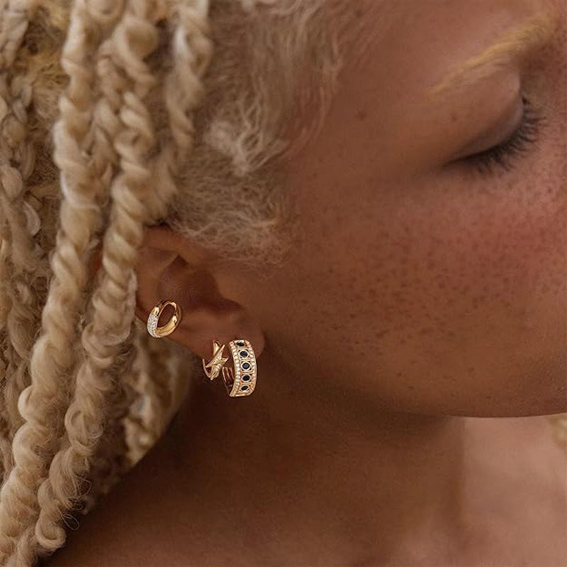 Close-up of MYEARS® Lightning Bolt Hoop Earrings worn by a woman, showing the unique lightning bolt design in elegant gold