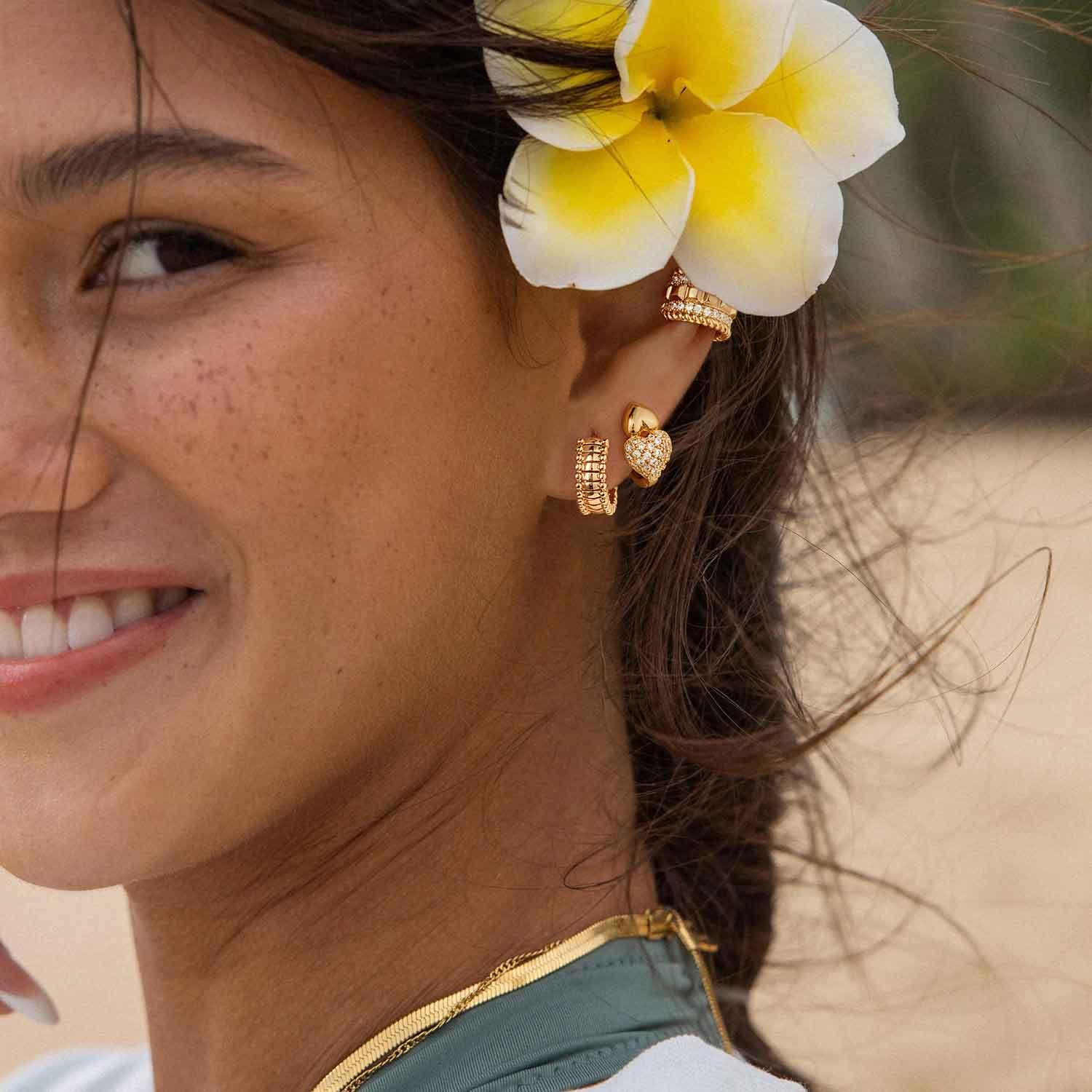 Model wearing MYEARS® pumpkin beaded ribbed hoop earrings, textured gold hoops for women