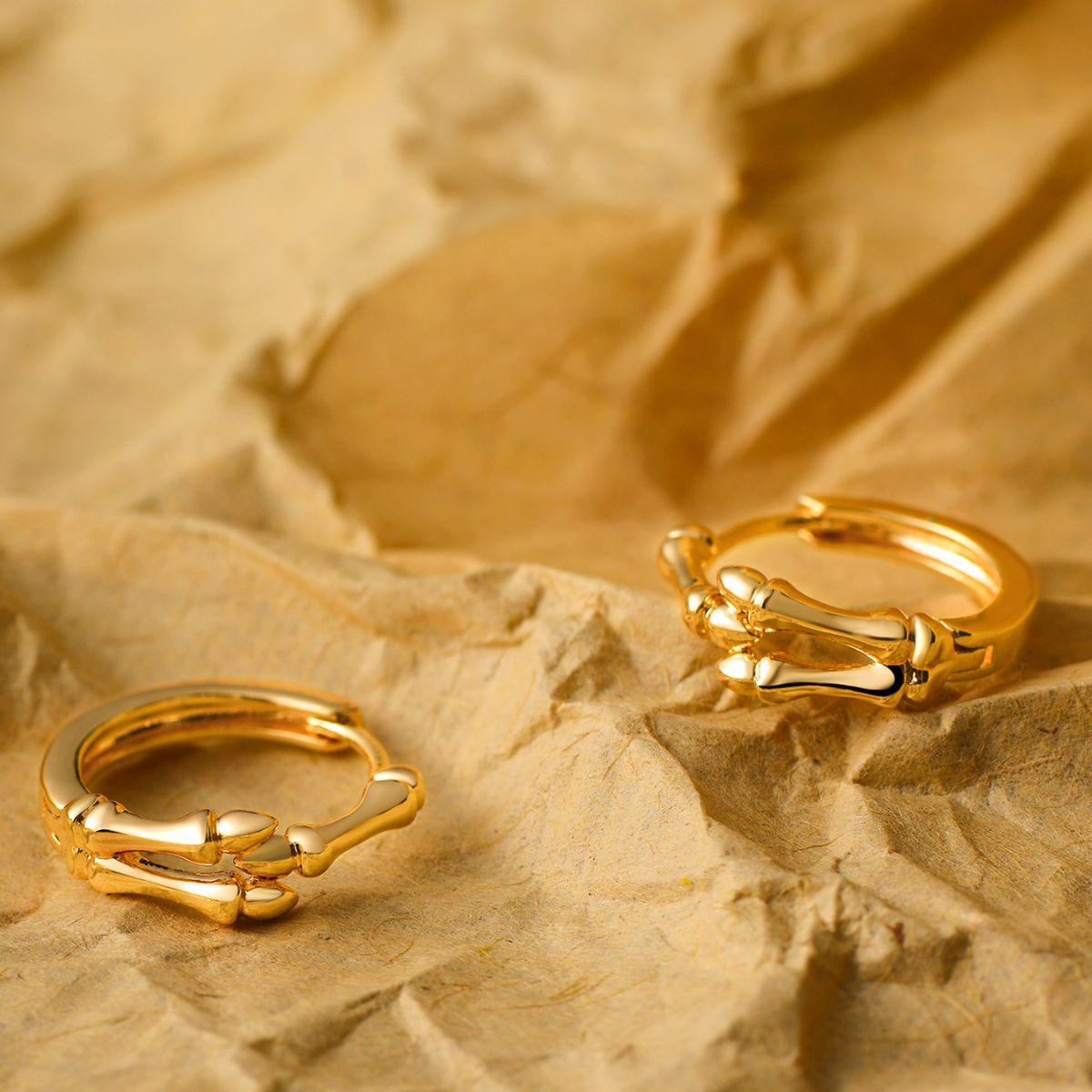 Model wearing MYEARS® skull hand hoop earrings, gold hoop earrings for women everyday wear