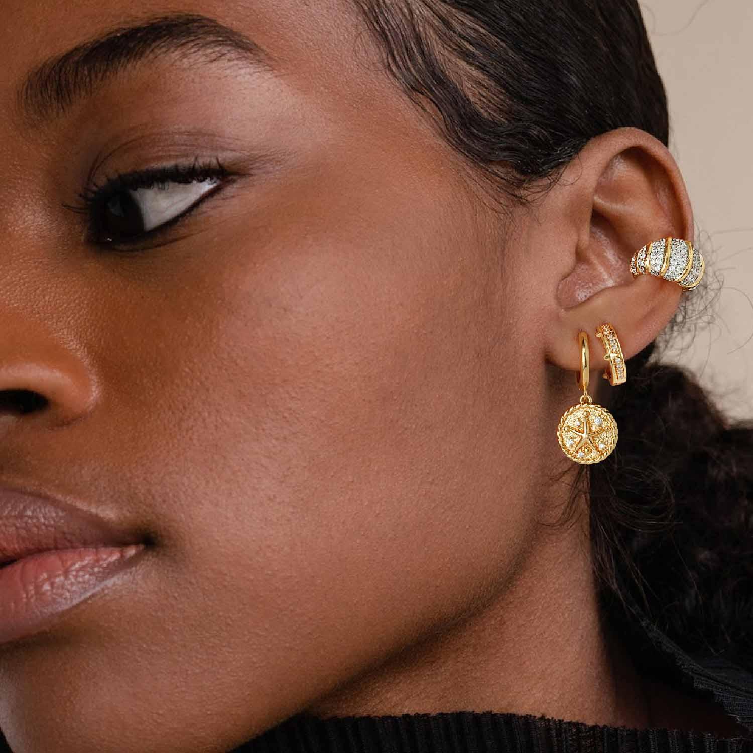 Close-up of MYEARS® Starfish Dangle Hoop Earrings, stylish gold hoops for women