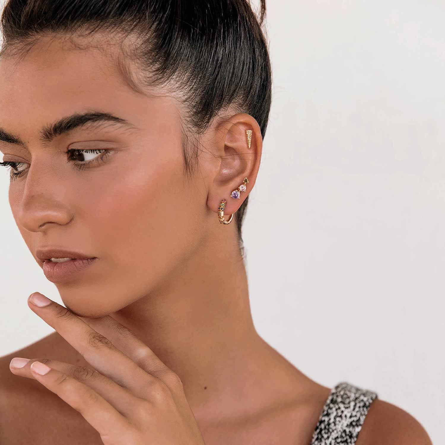 Close-up of model wearing MYEARS® Triangle CZ Stud Earrings, gold earrings with sparkling cubic zirconia, stylish and delicate for daily wear