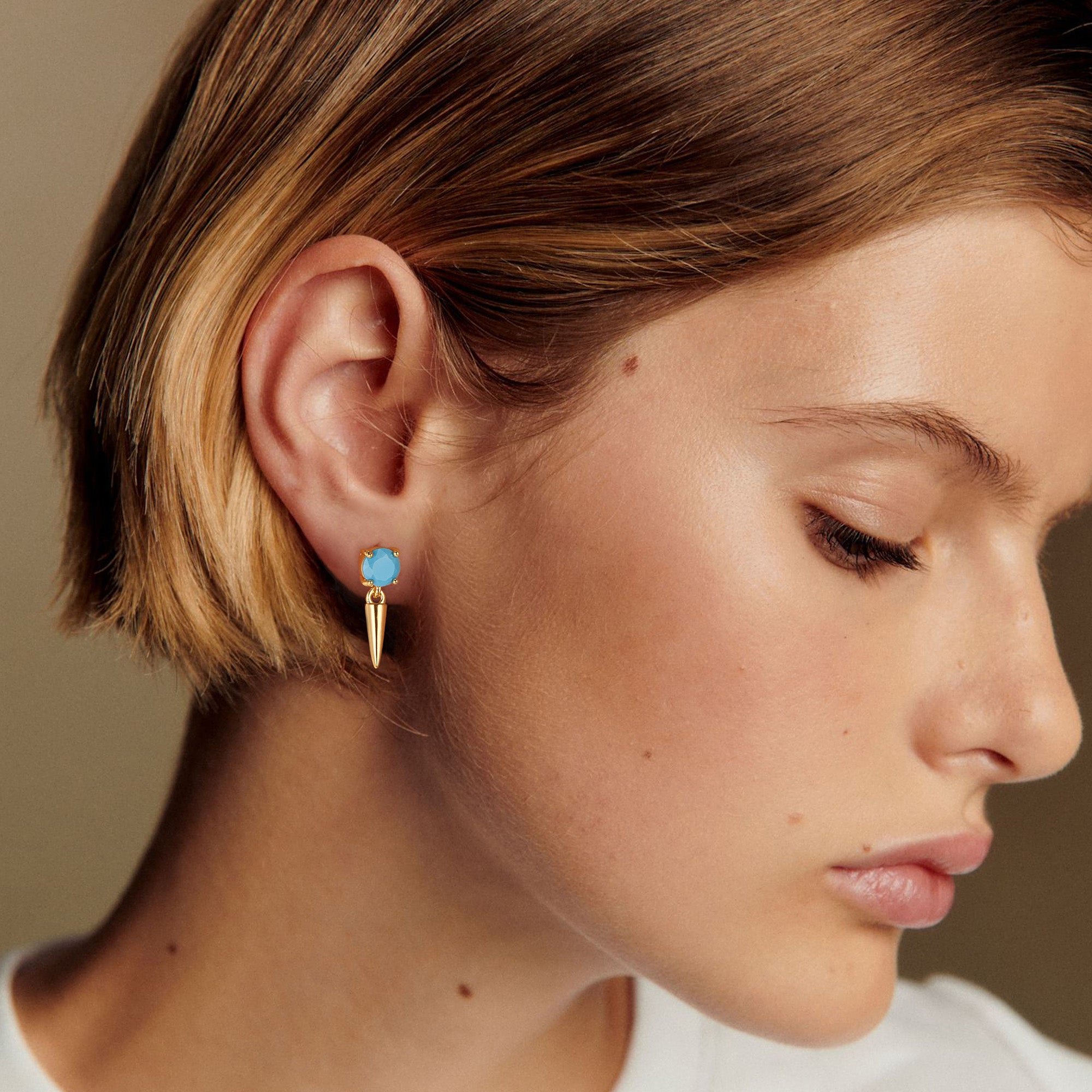 Close-up of model wearing MYEARS® Turquoise Cone Drop Stud Earrings, showcasing elegant gold design with turquoise accents, ideal for women’s daily fashion and gift occasions