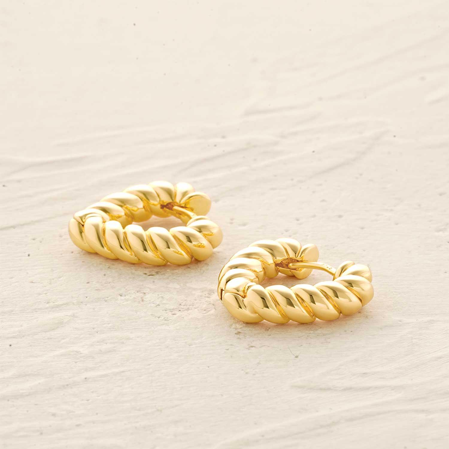 Detailed view of MYEARS® twisted heart huggie hoop earrings highlighting the gold twisted heart design and fine craftsmanship