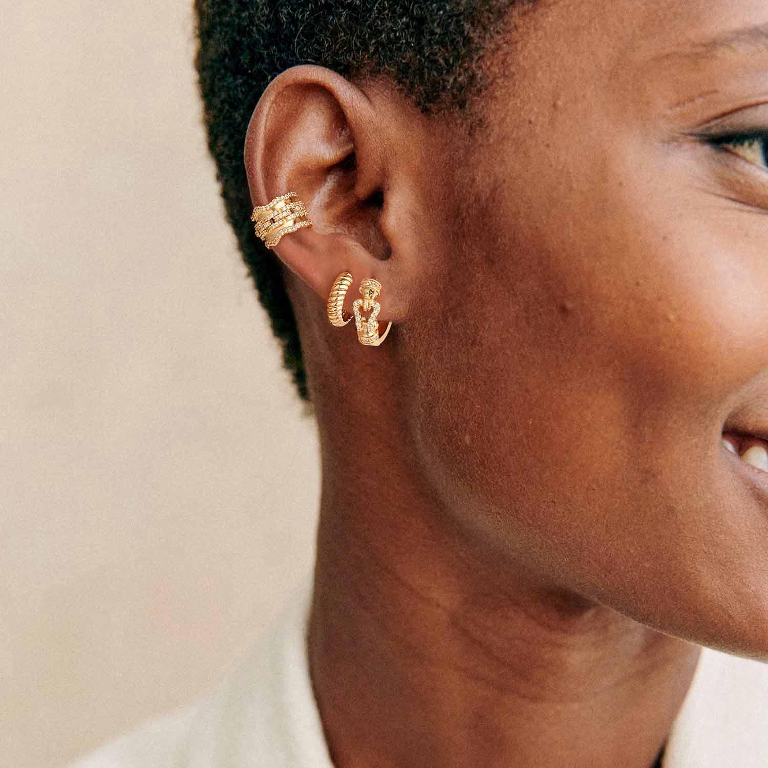 Lifestyle image of MYEARS® Twisted Hoop Earrings in gold, ideal for gifting and everyday wear