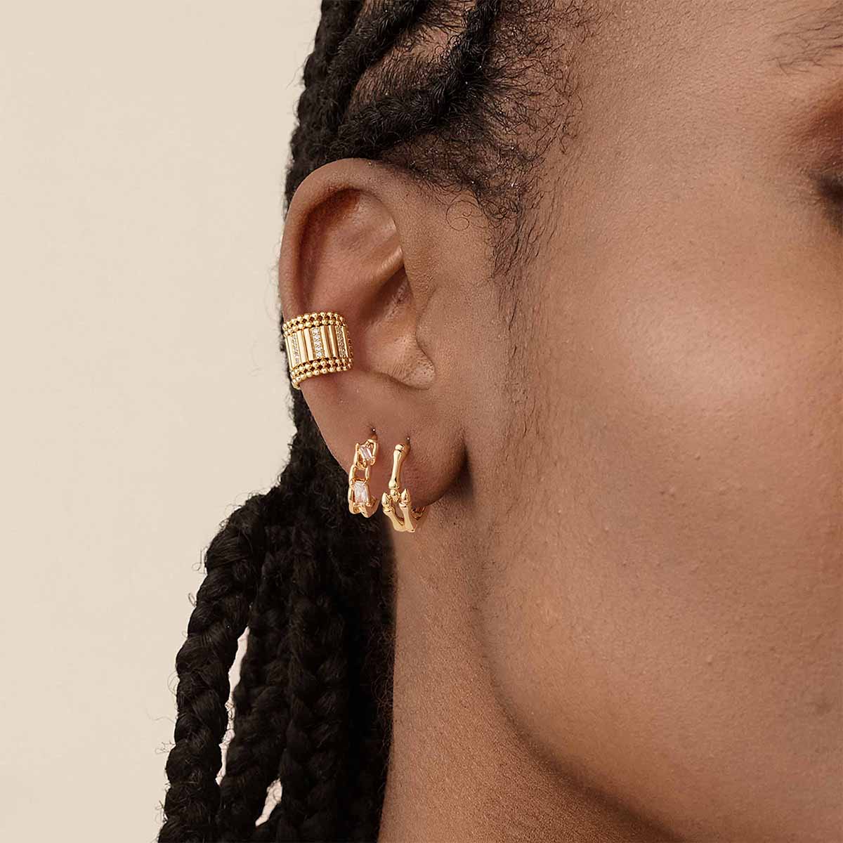 Close-up of MYEARS® CZ Chain Link Hoop Earrings in gold on model, showing sparkling cubic zirconia and intricate chain link design