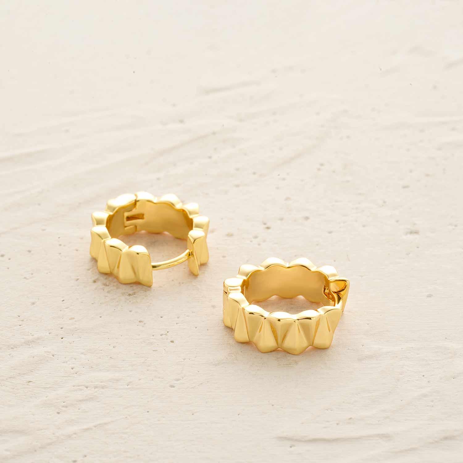 Detailed view of MYEARS® chunky frill huggie hoop earrings showing the layered frill design and polished gold finish