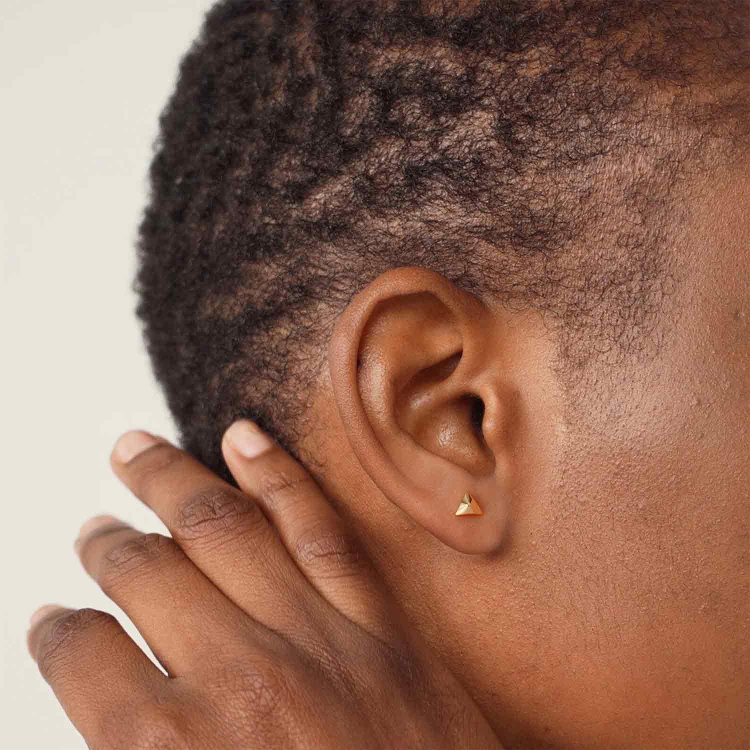 Model wearing MYEARS® Triangular Pyramid Stud Earrings Set, stylish gold geometric studs for women, perfect for everyday wear or gifting.