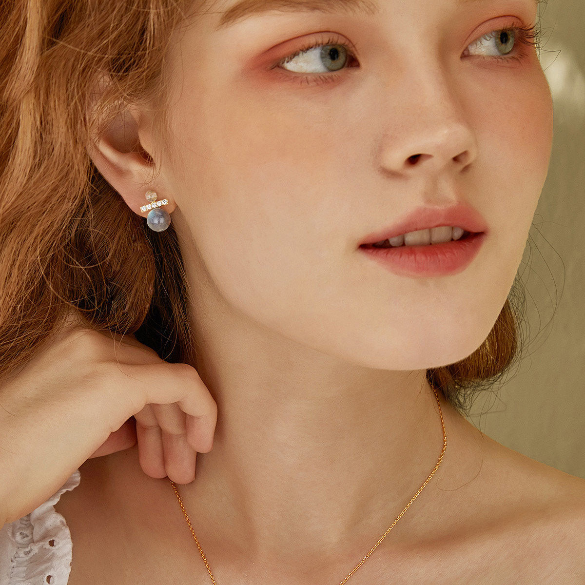 Woman wearing MYEARS Labradorite Spherical Stud Earrings