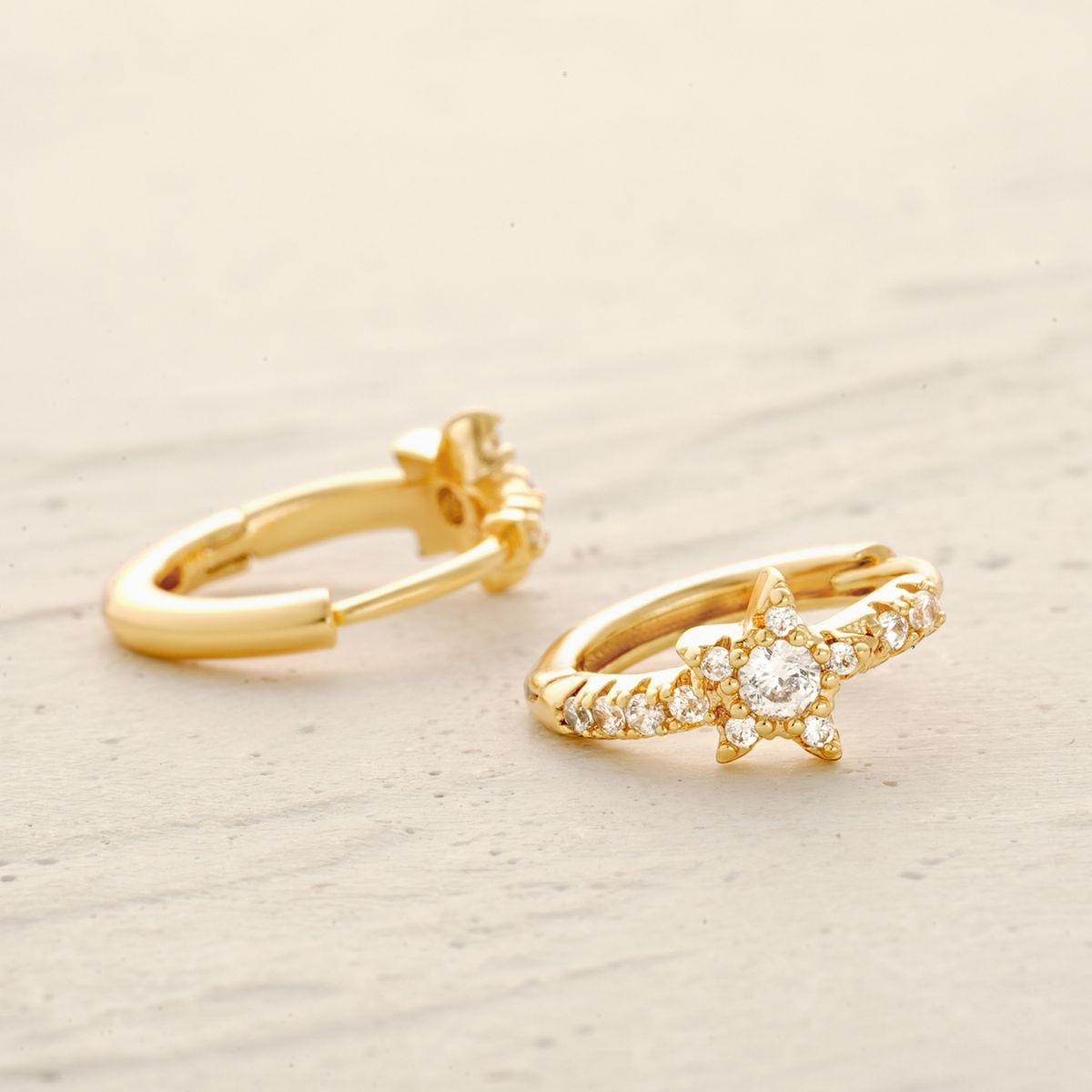 Star Huggie Hoop Earrings in gold worn by model, trendy everyday earrings for women