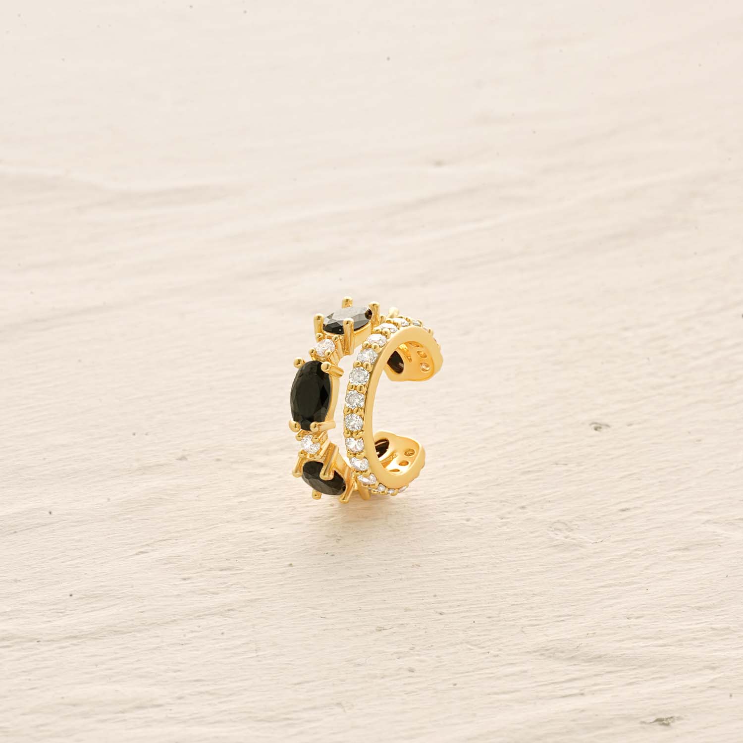 Detailed view of MYEARS® Black Onyx Ear Cuff No Piercing Earrings, showing smooth gold finish and black onyx accent