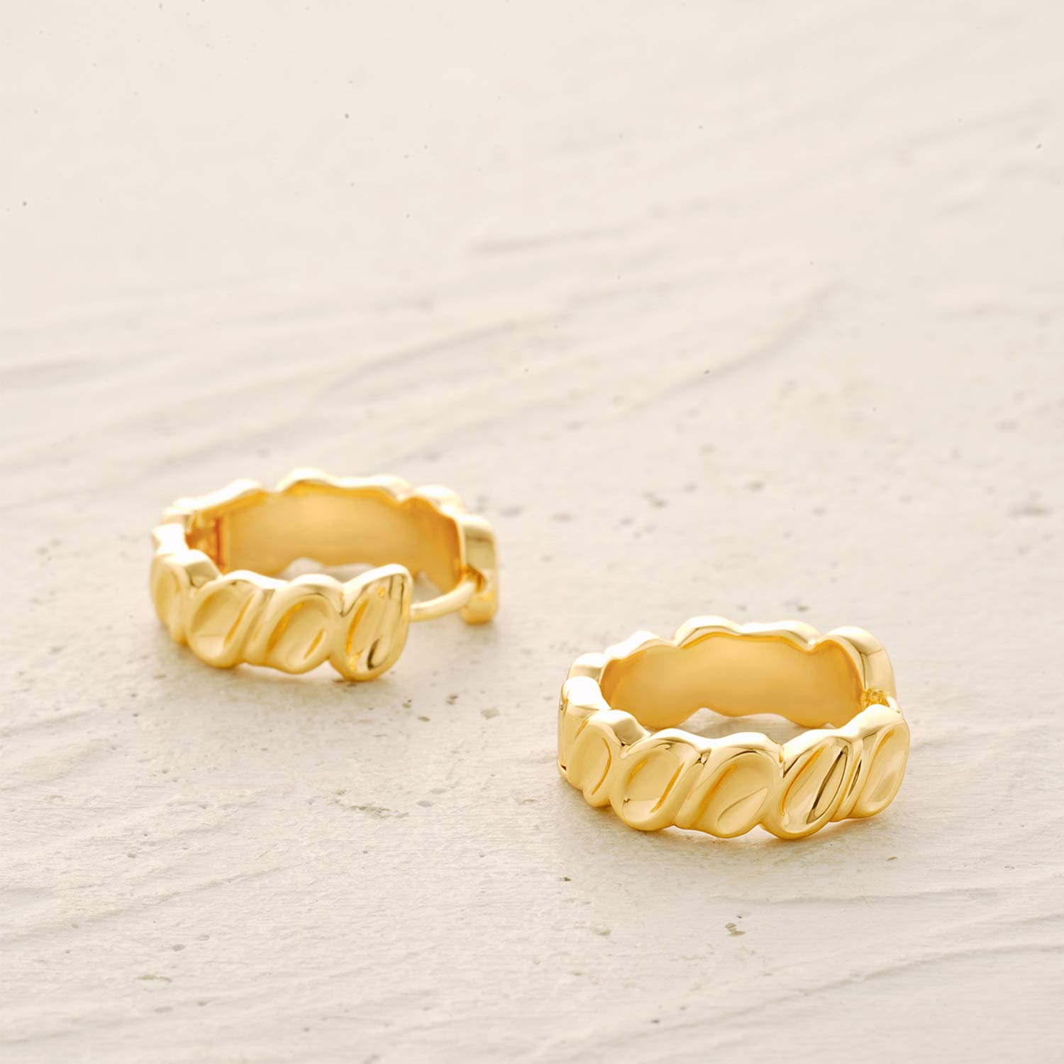 Twisted Trough Band Huggie Earrings