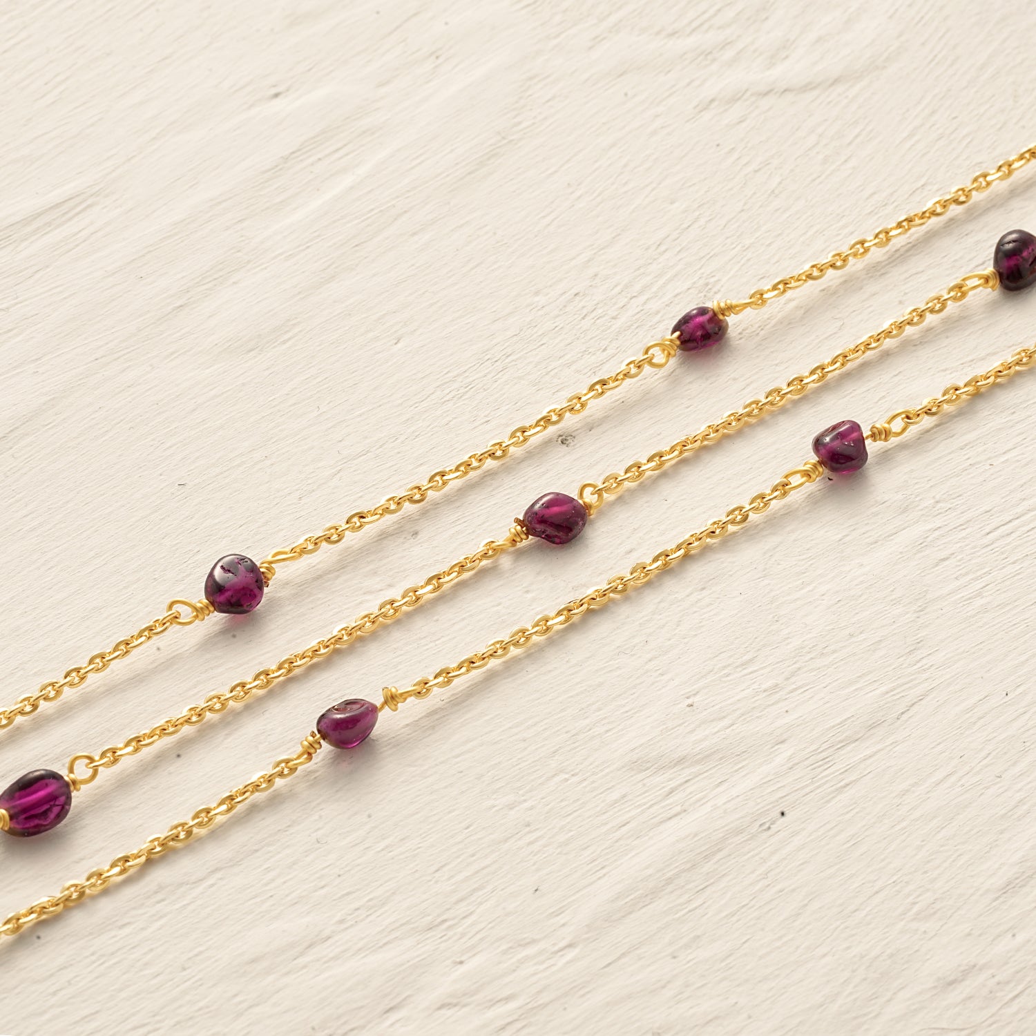 Detail shot of the Myears® black amethyst necklace showing the 14k gold-plated chain and polished black onyx pendant