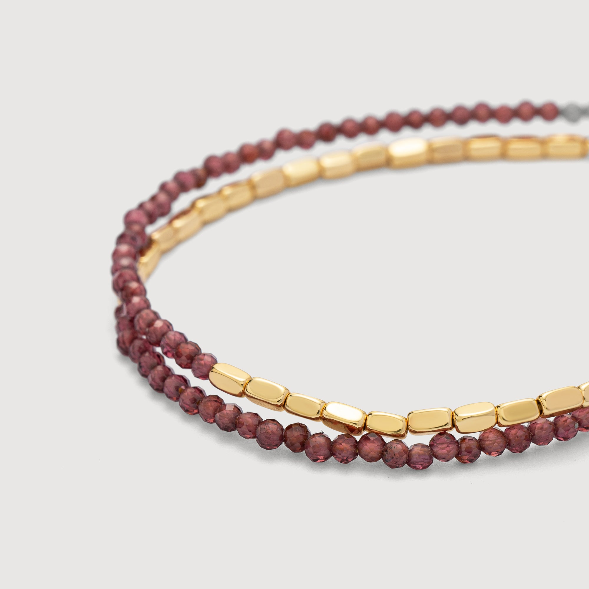 Detail shot of the Myears® Amethyst Square Chain Double-Layer Bracelet showing the 14k gold-plated chain and polished black onyx beads 