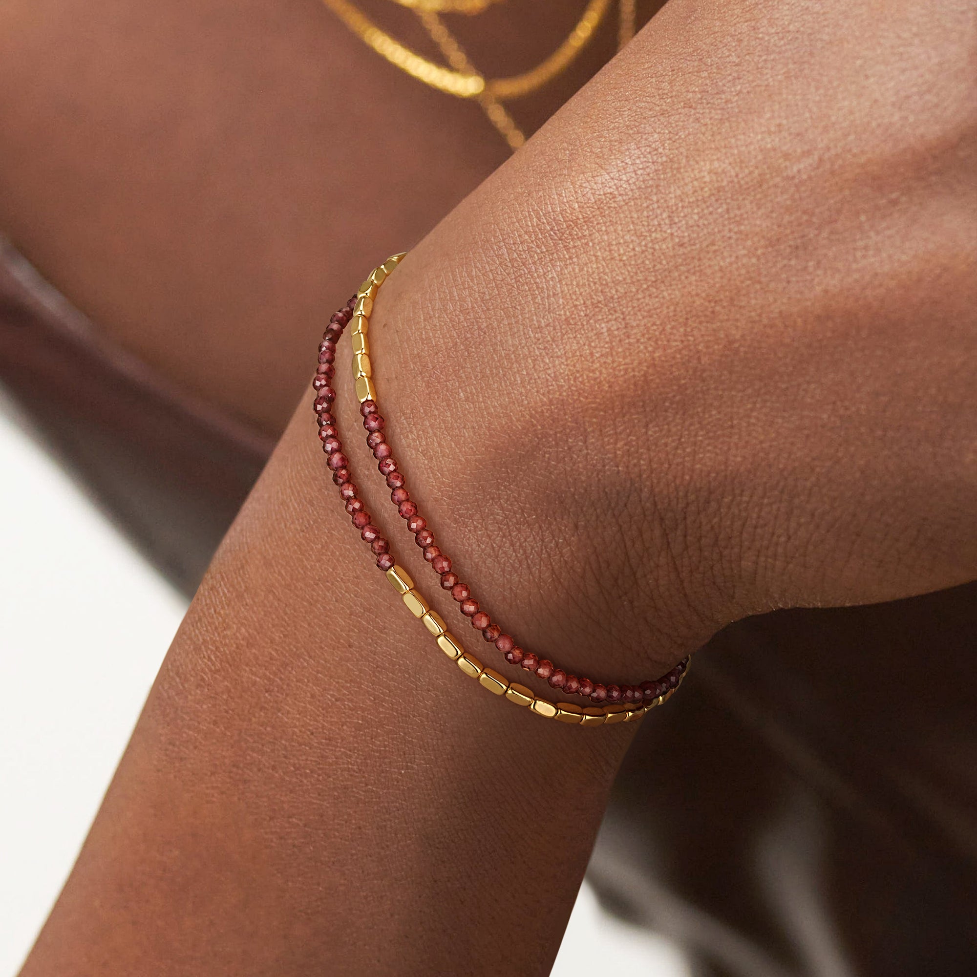 Model wearing the Myears® Amethyst Square Chain Double-Layer Bracelet, 14k gold-plated chain, close-up portrait
