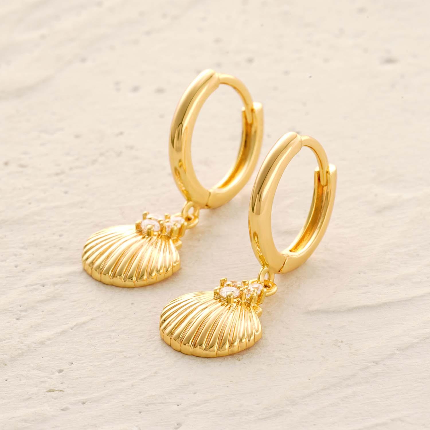 Detailed view of MYEARS® clam shell CZ dangle earrings showing the sparkling cubic zirconia and clam shell craftsmanship.