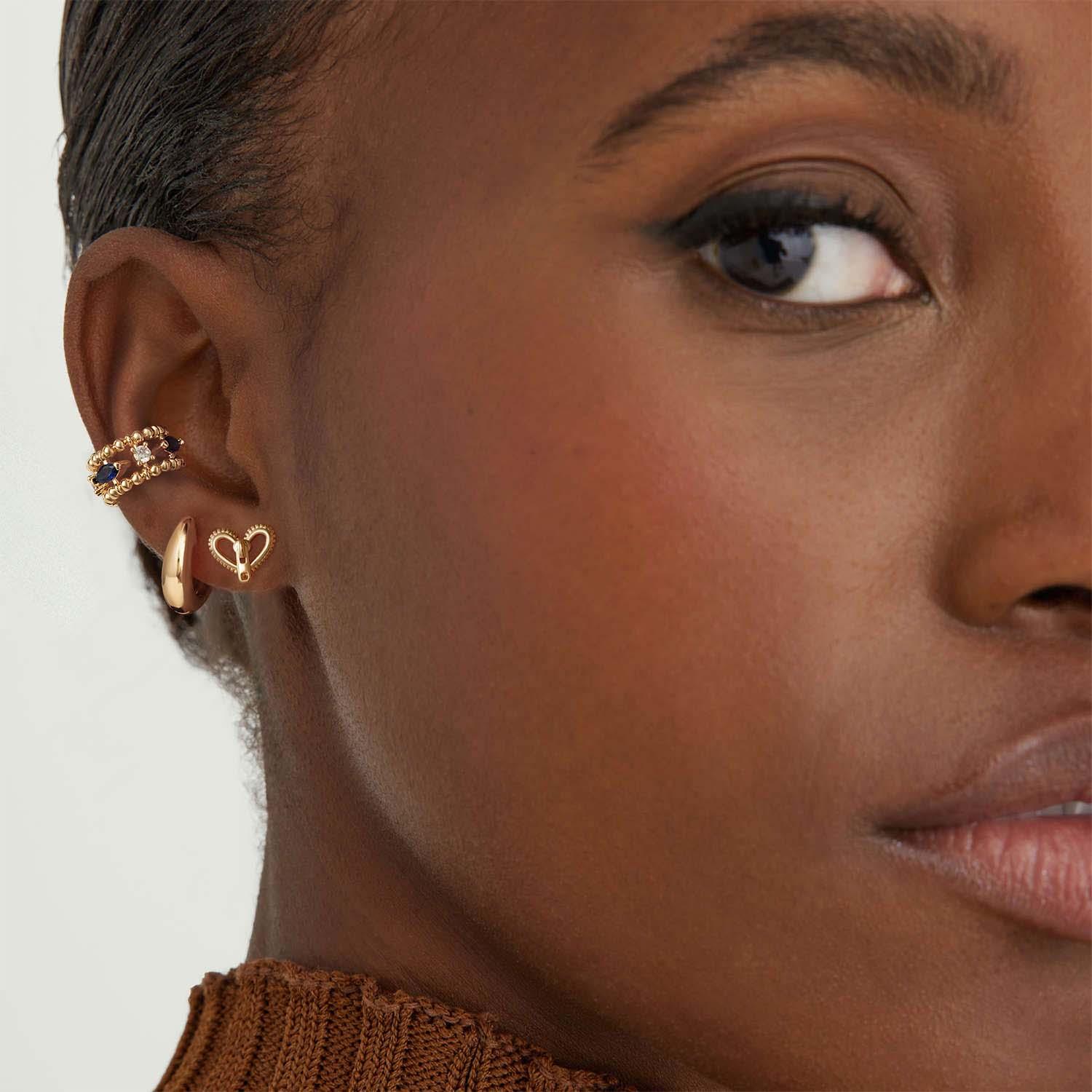 Close-up of MYEARS® Small Huggie Hoop Earrings, delicate gold hoops for women