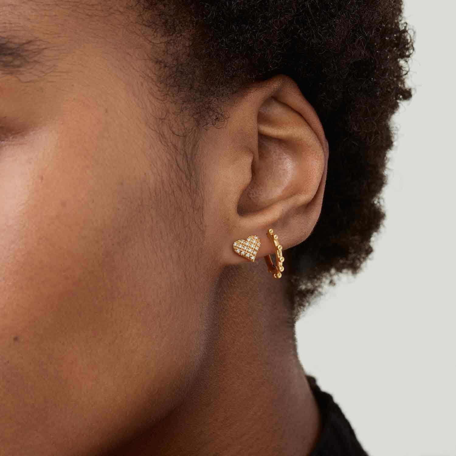 MYEARS® Gold Sun Beaded Huggie Hoop Earrings worn by model, trendy and elegant everyday earrings for women